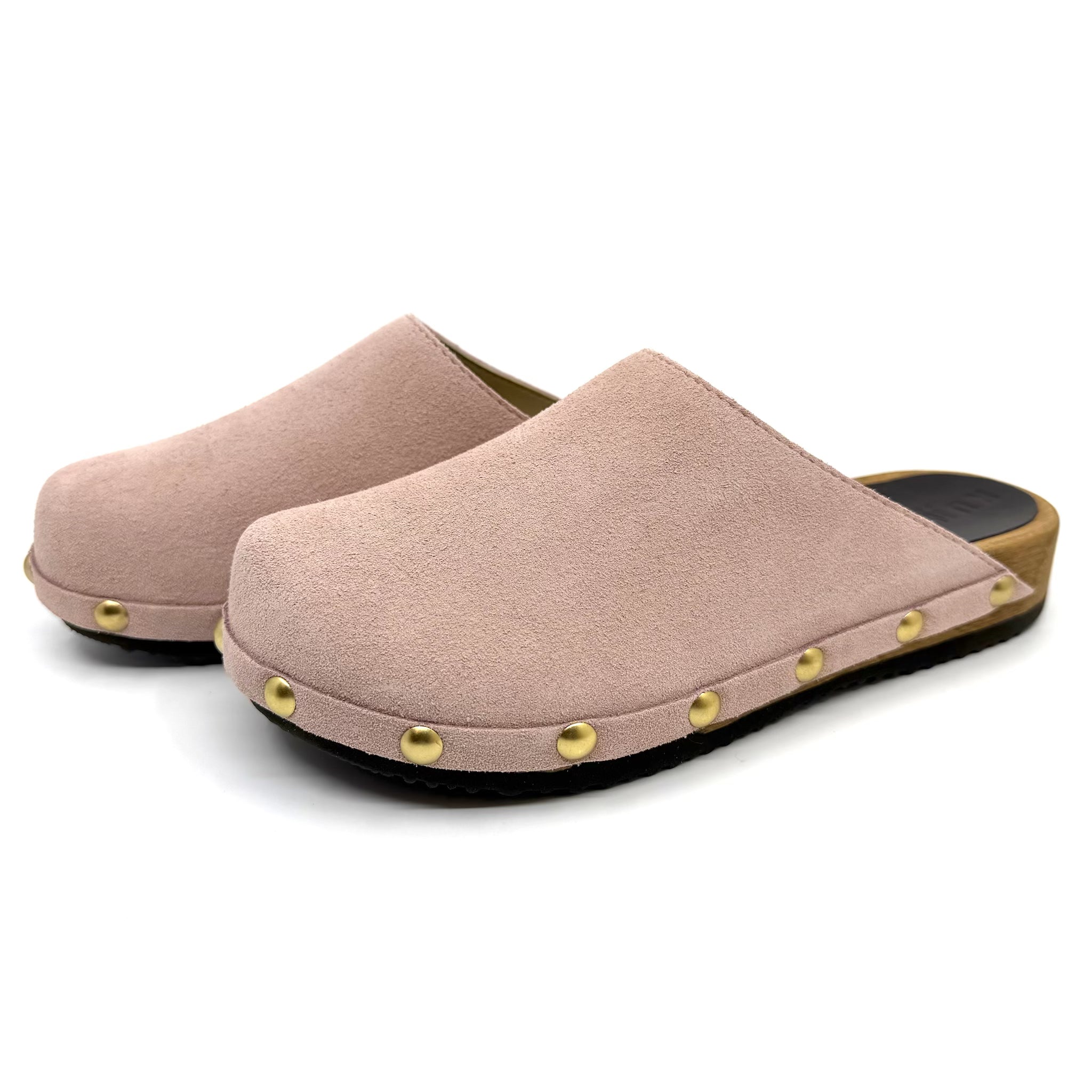 Pair of pink slippers with gold studs on a white background