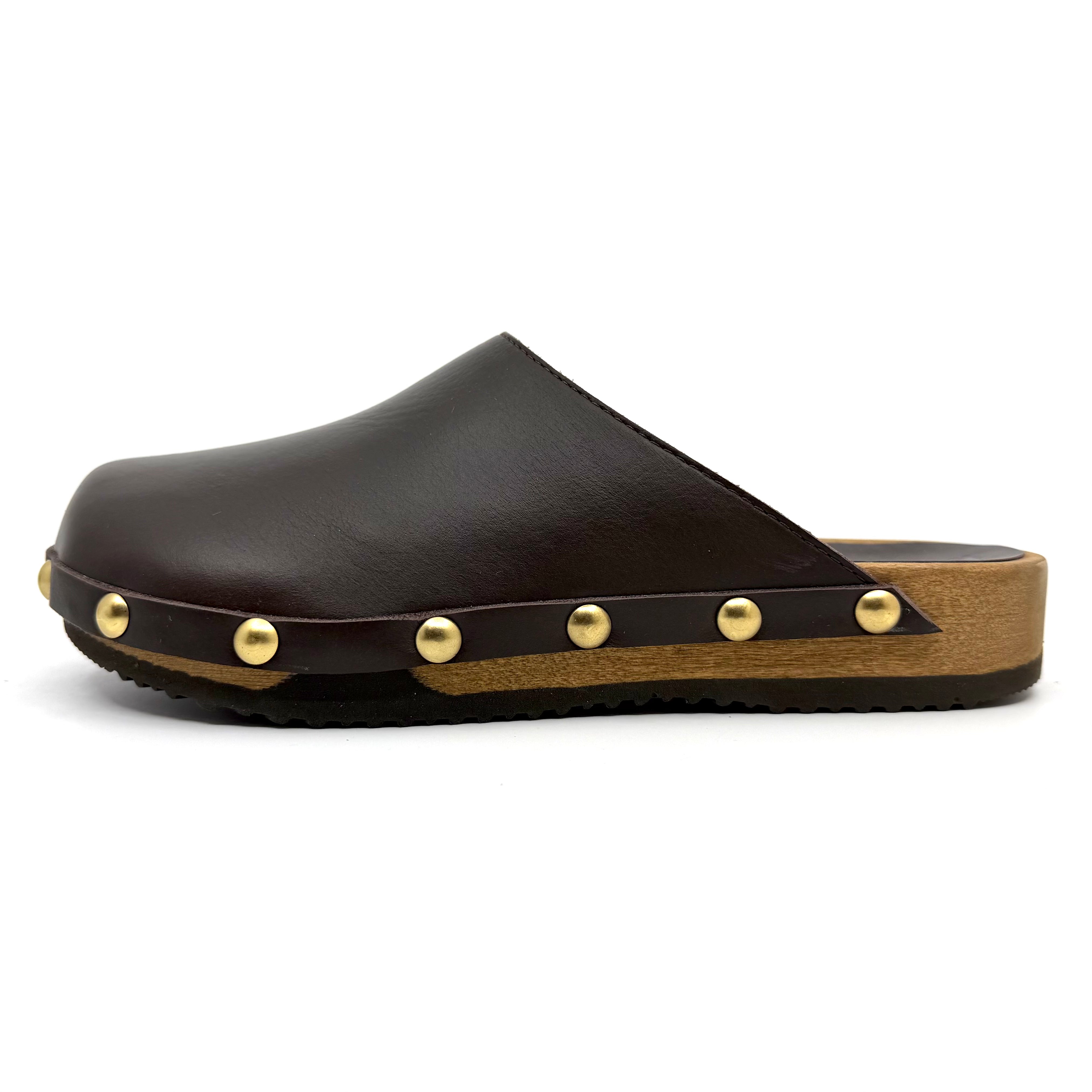 Brown leather clog with gold studs on a white background