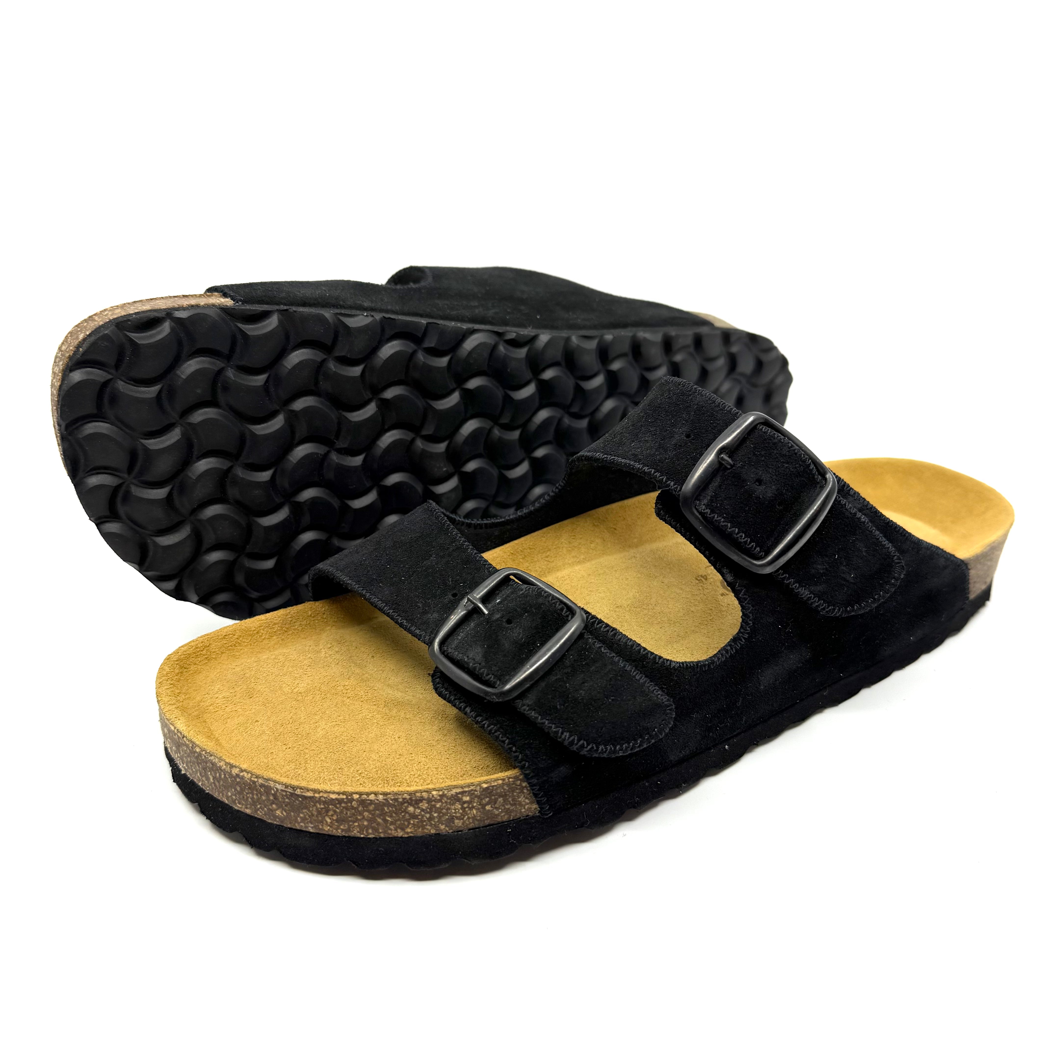 Black sandals with cork sole on a white background