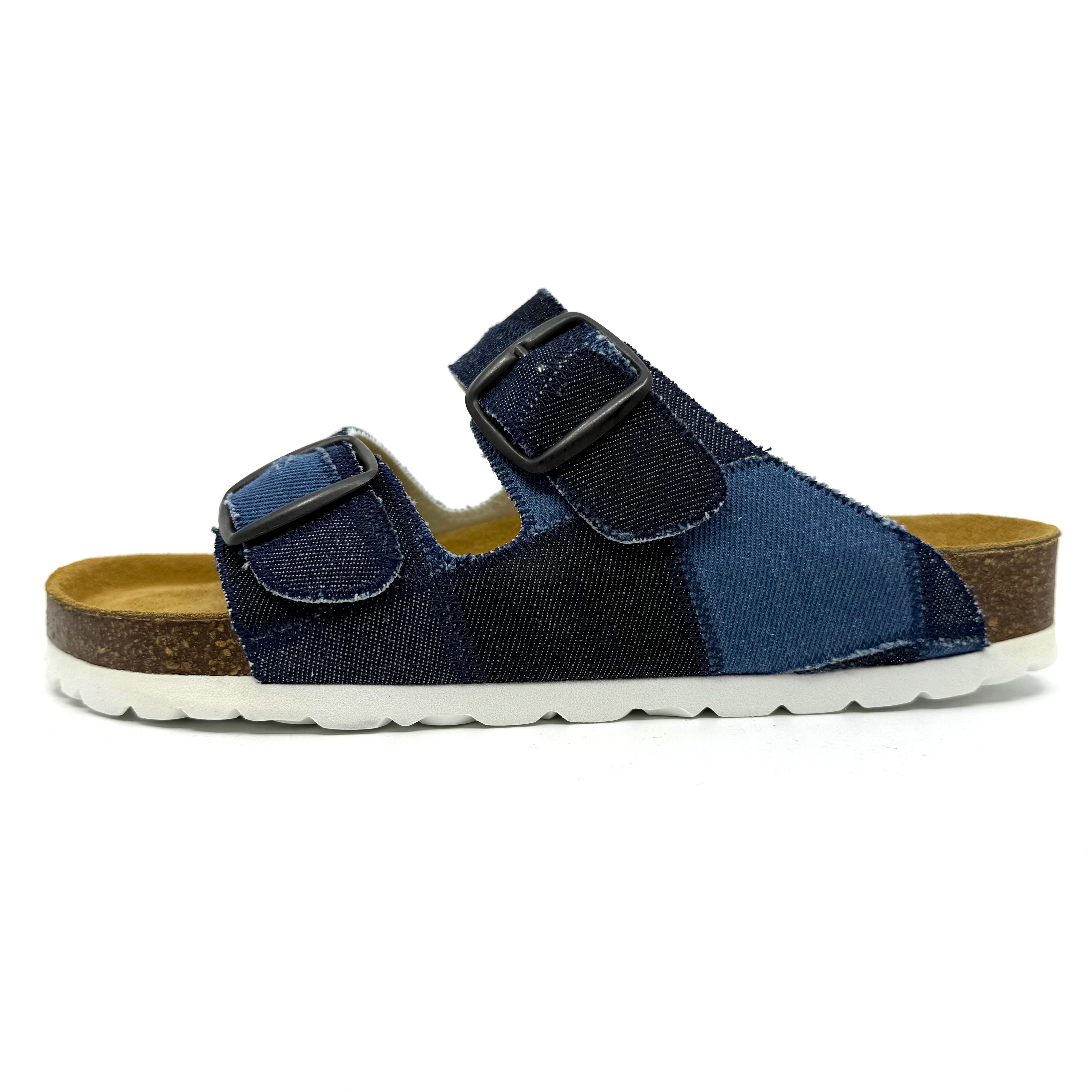 Navy sandal with a brown sole on a white background
