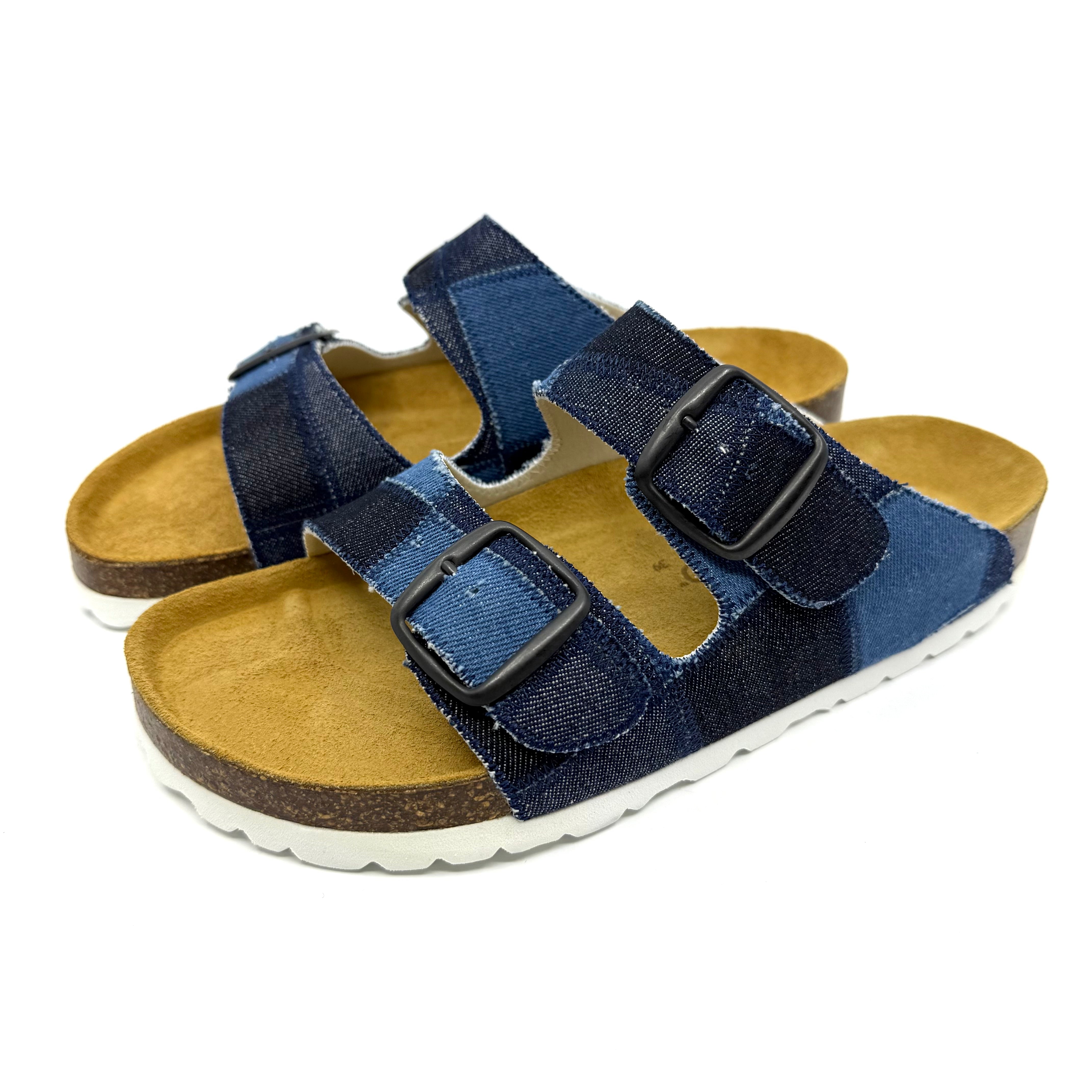 Pair of blue sandals with velcro straps on a white background