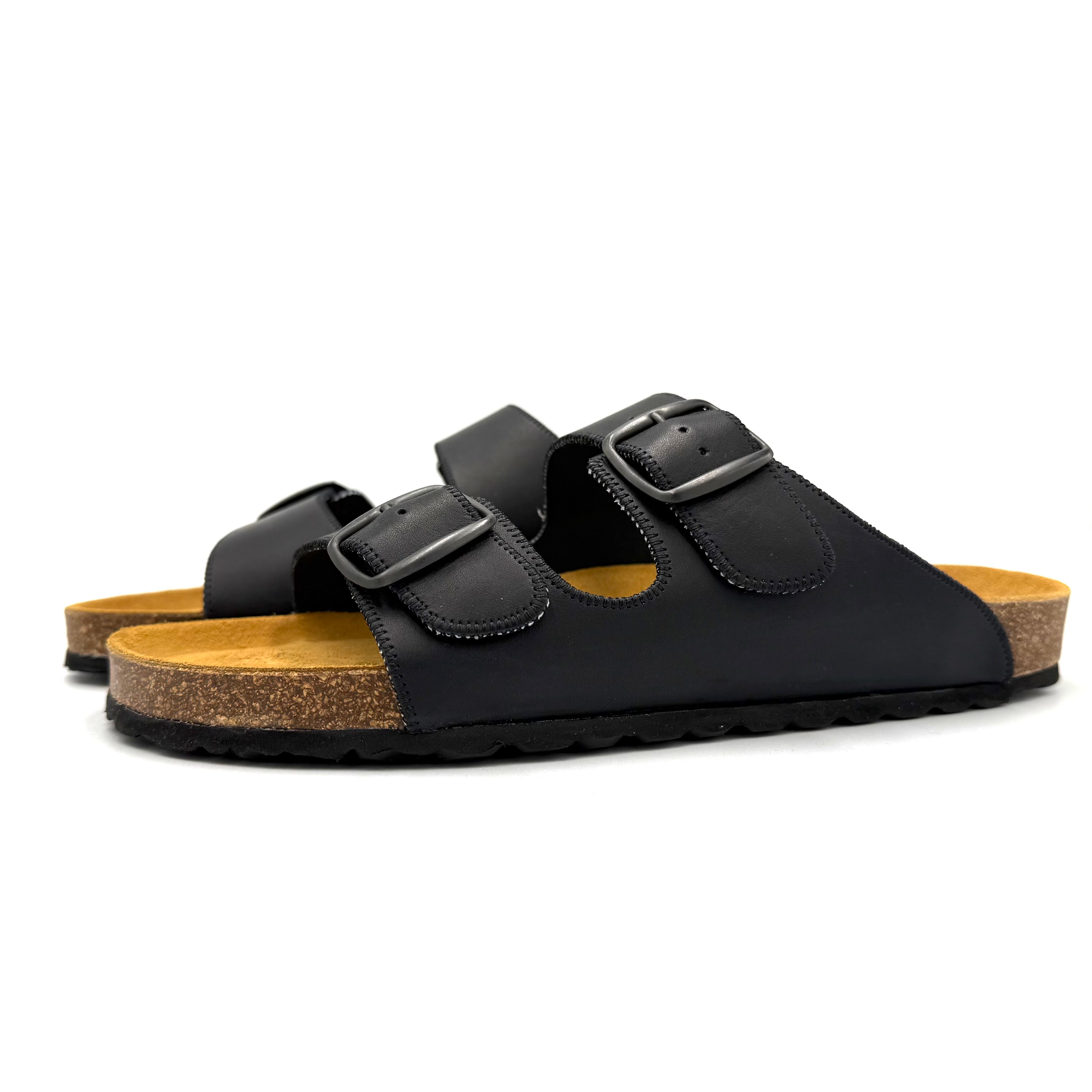 Black sandals with cork sole on a white background