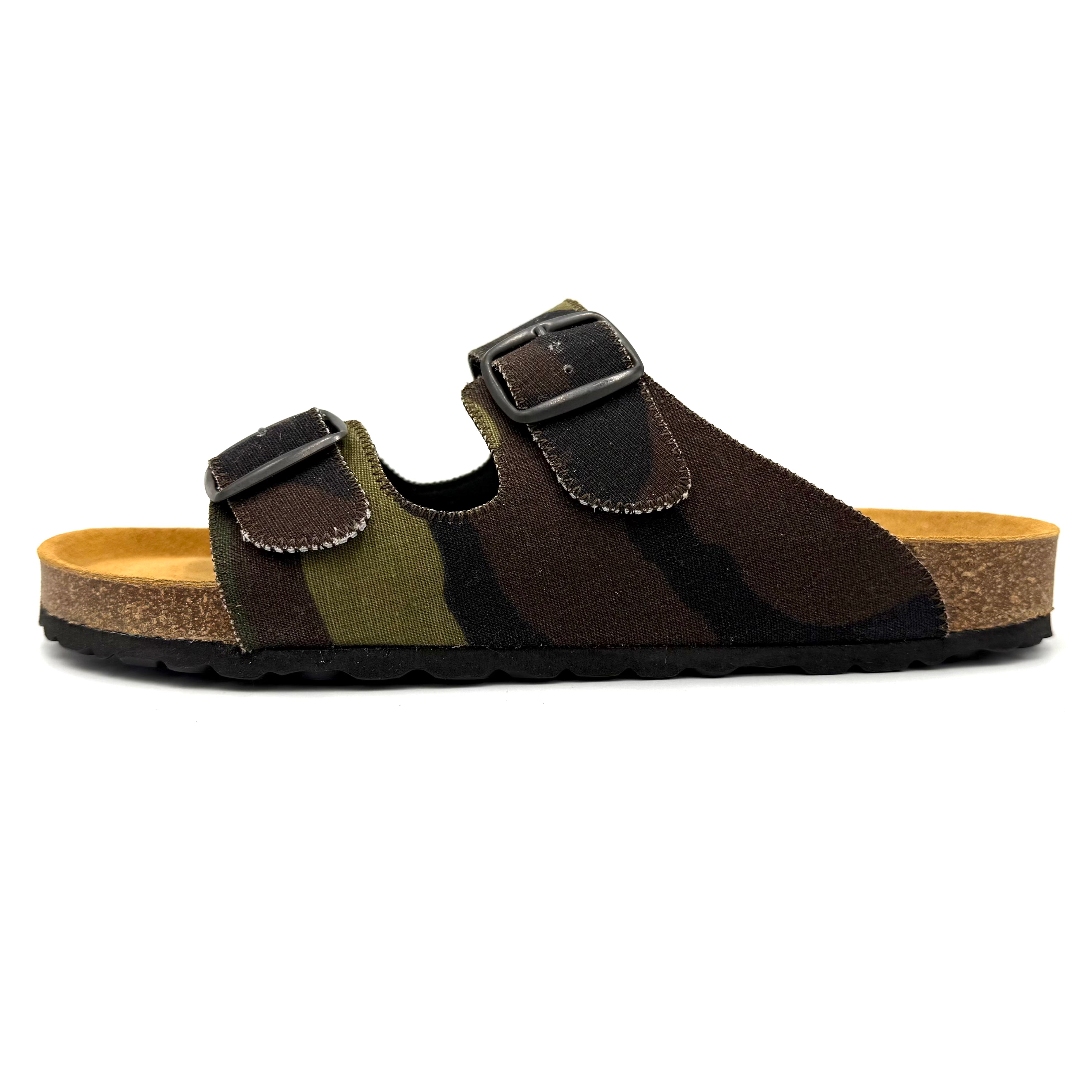 Camouflage-patterned sandal with brown buckle on a white background