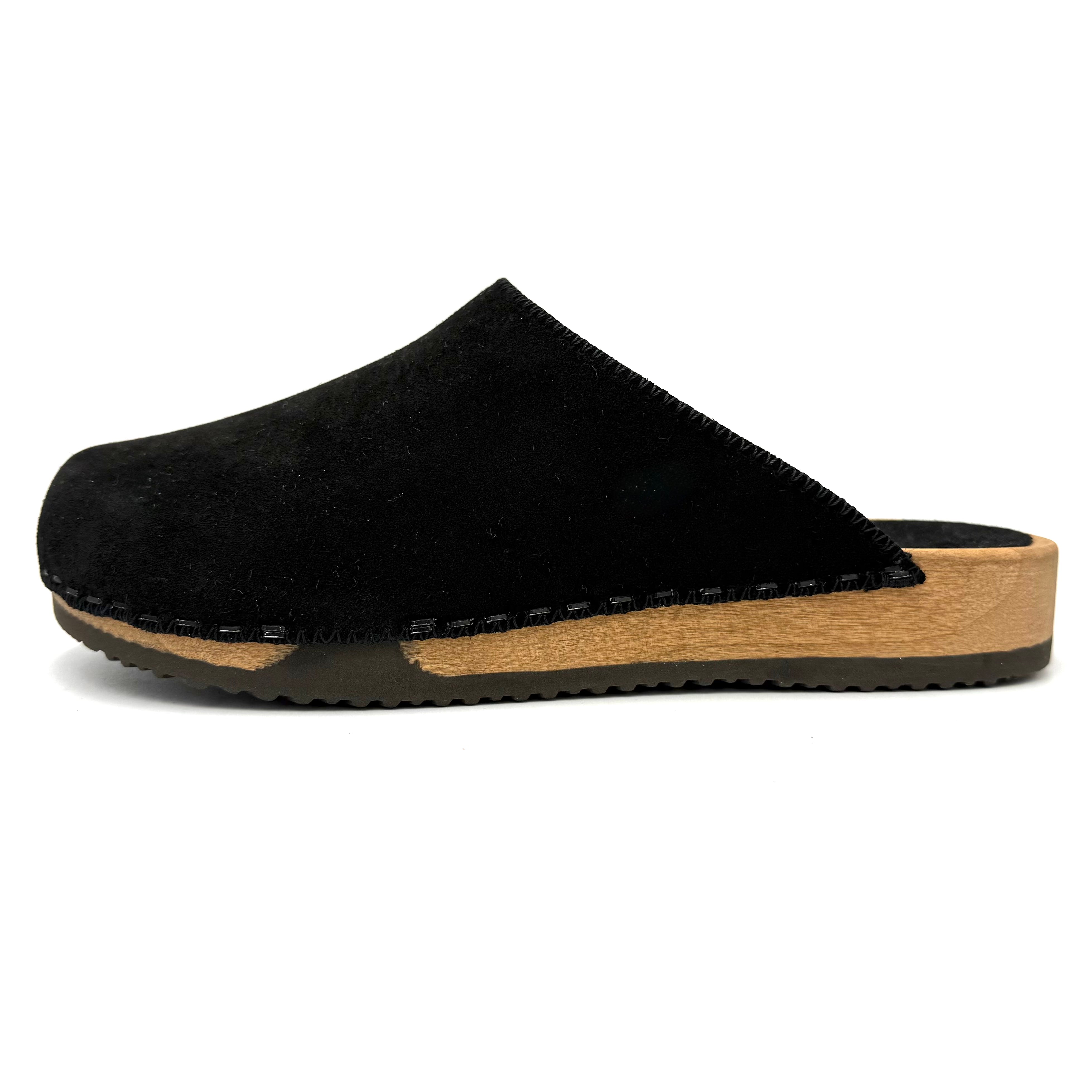 Black slipper with a wooden sole on a white background
