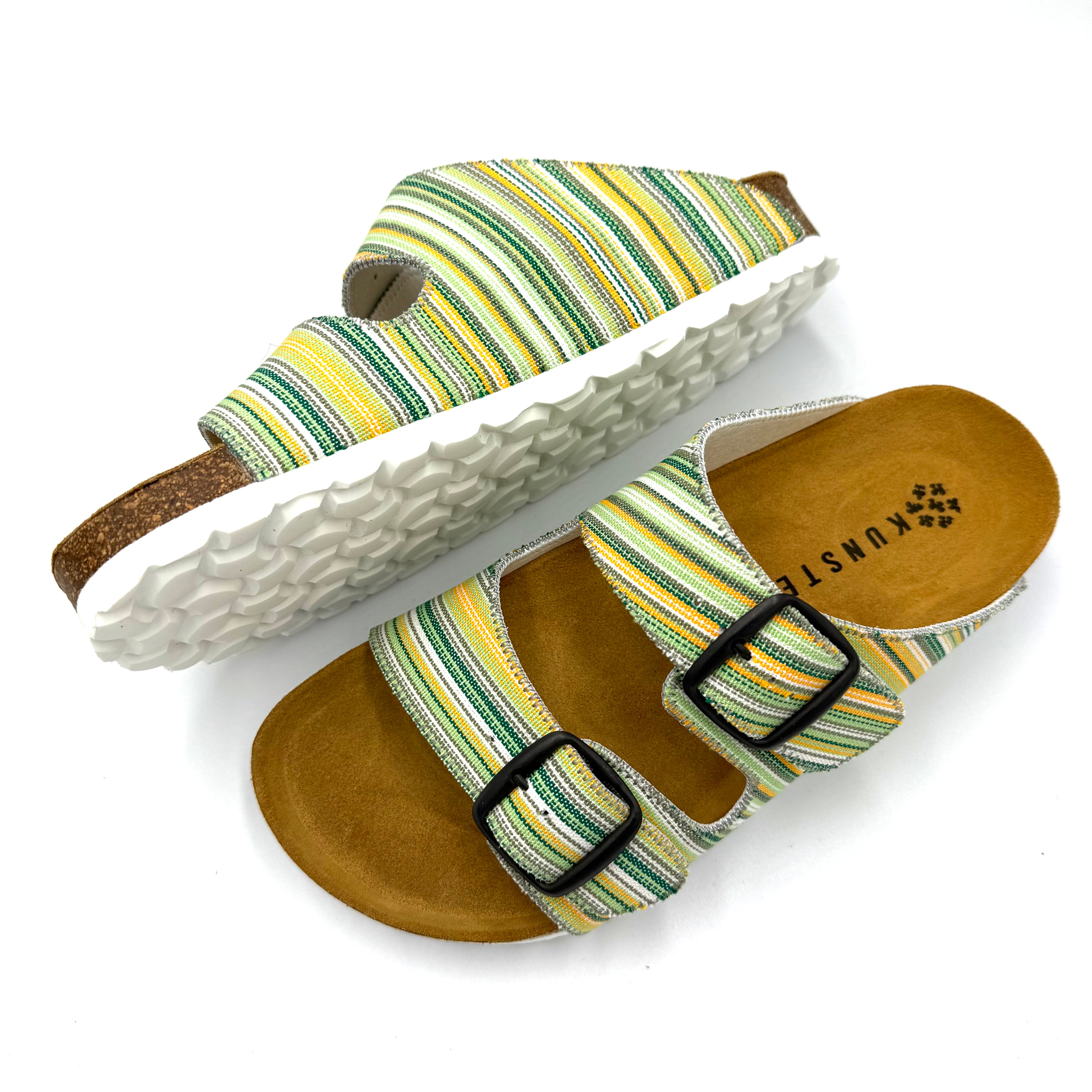 Striped sandals with a buckle on a white background