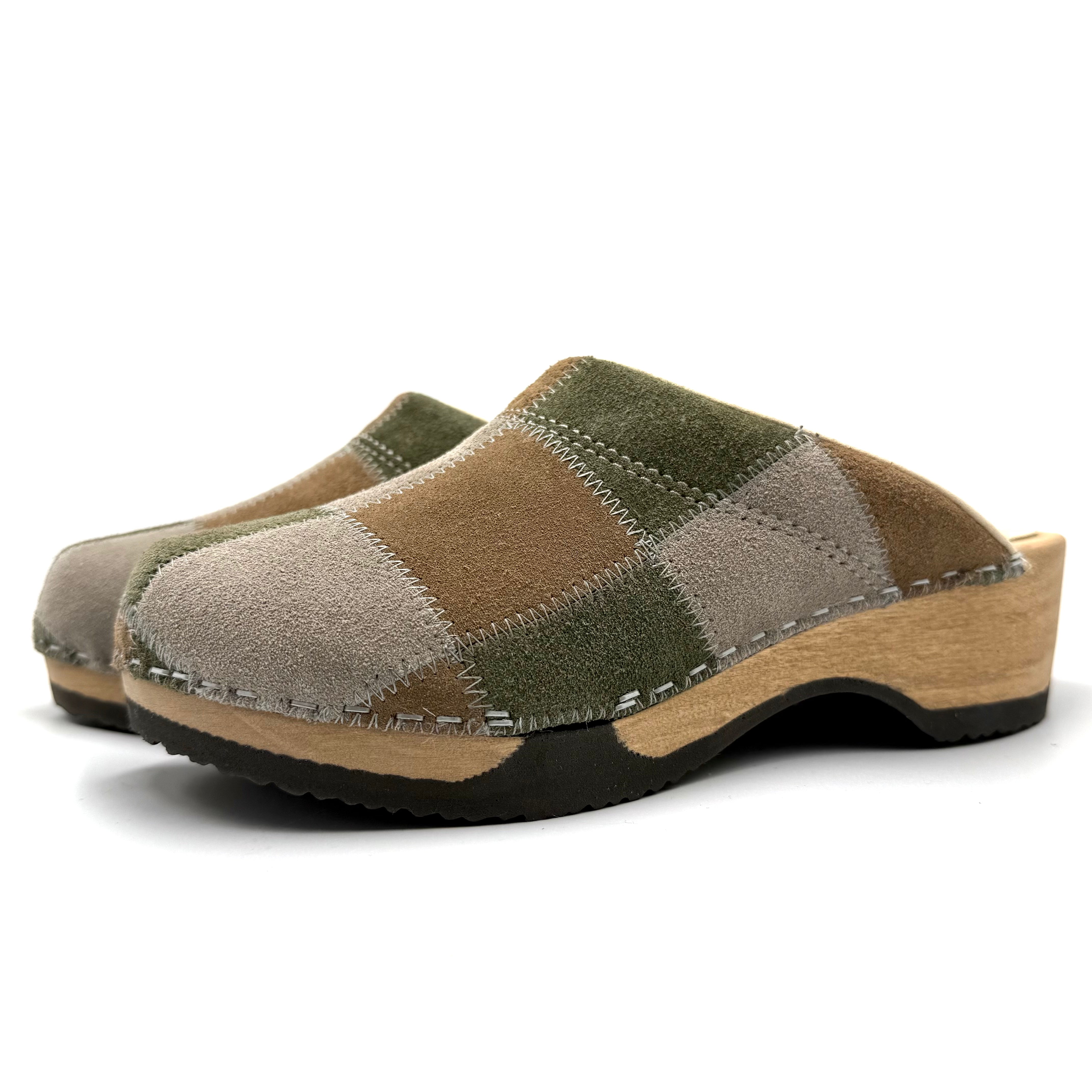 Pair of patchwork clogs on a white background