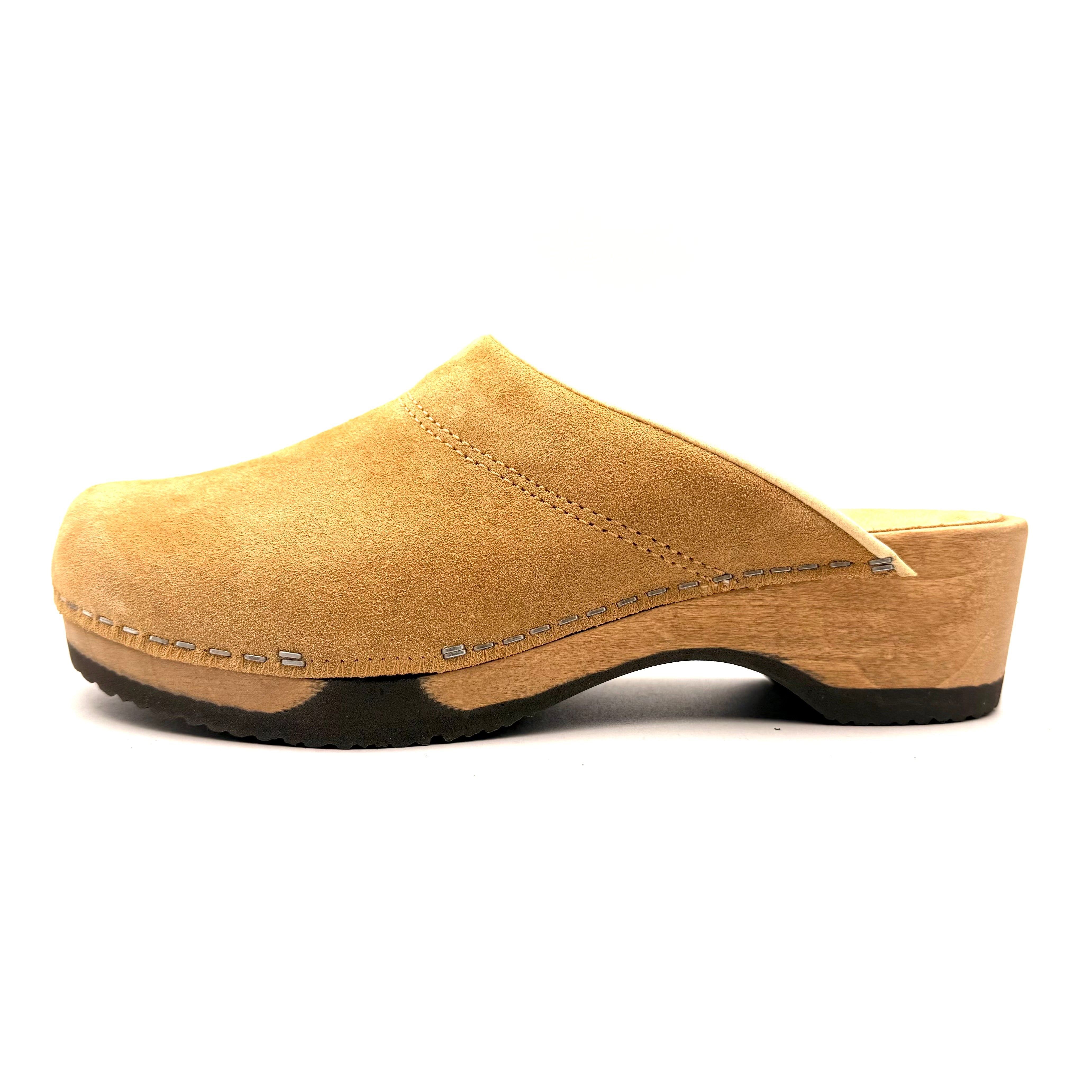 Tan wooden clog shoe on a white background