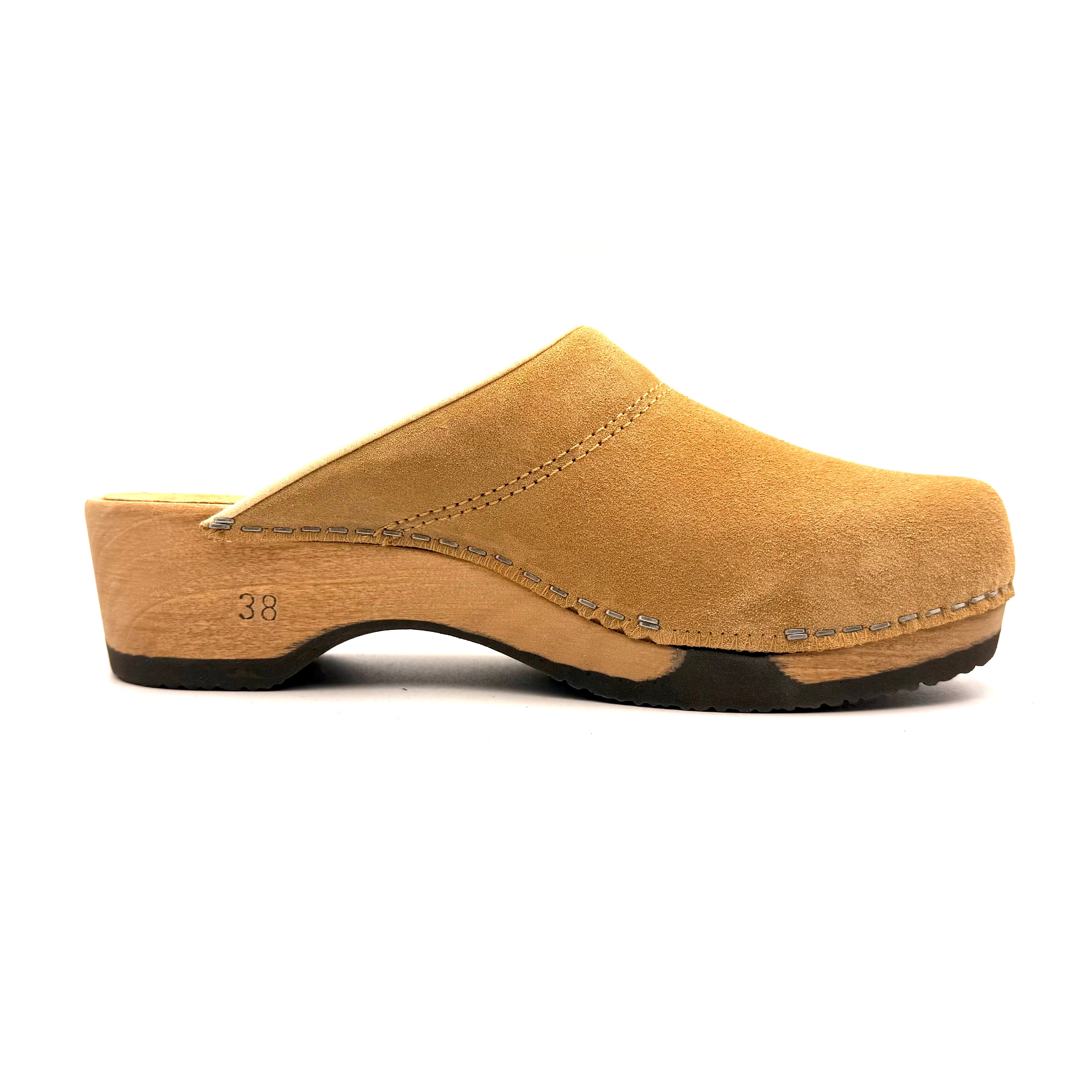 Tan clog shoe on a white background