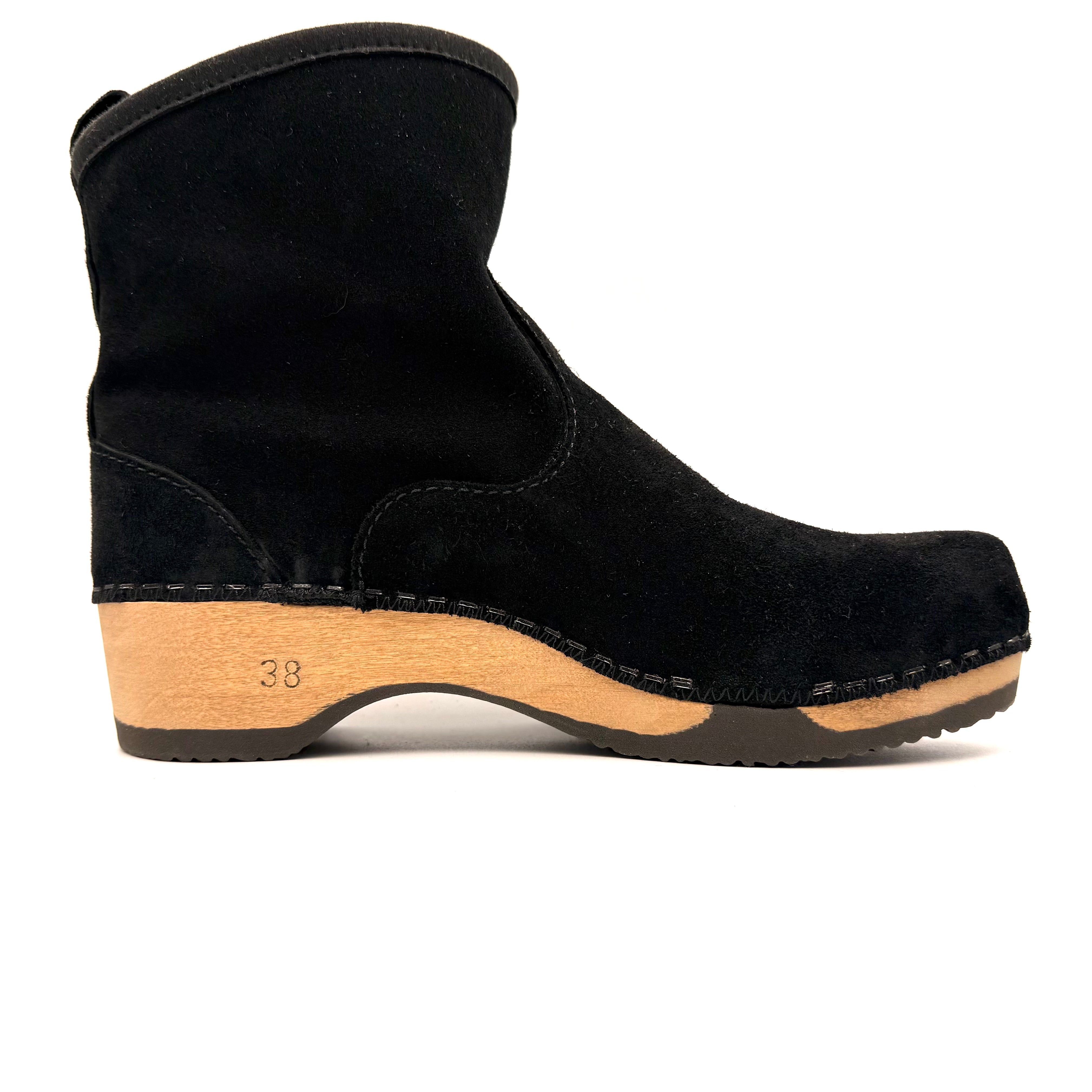 Black suede clog shoe with wooden sole on a white background