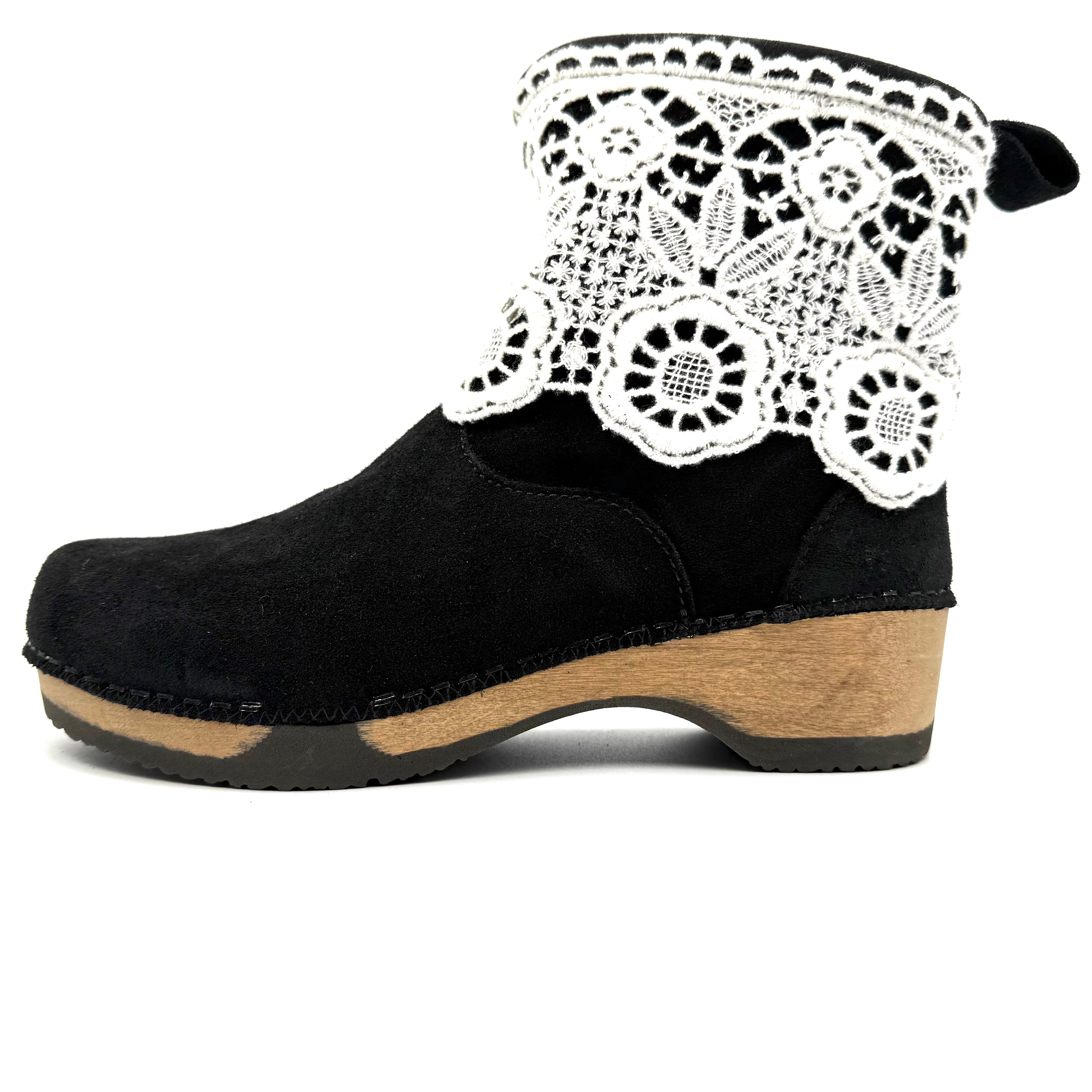 Black clog shoe with white lace on a white background