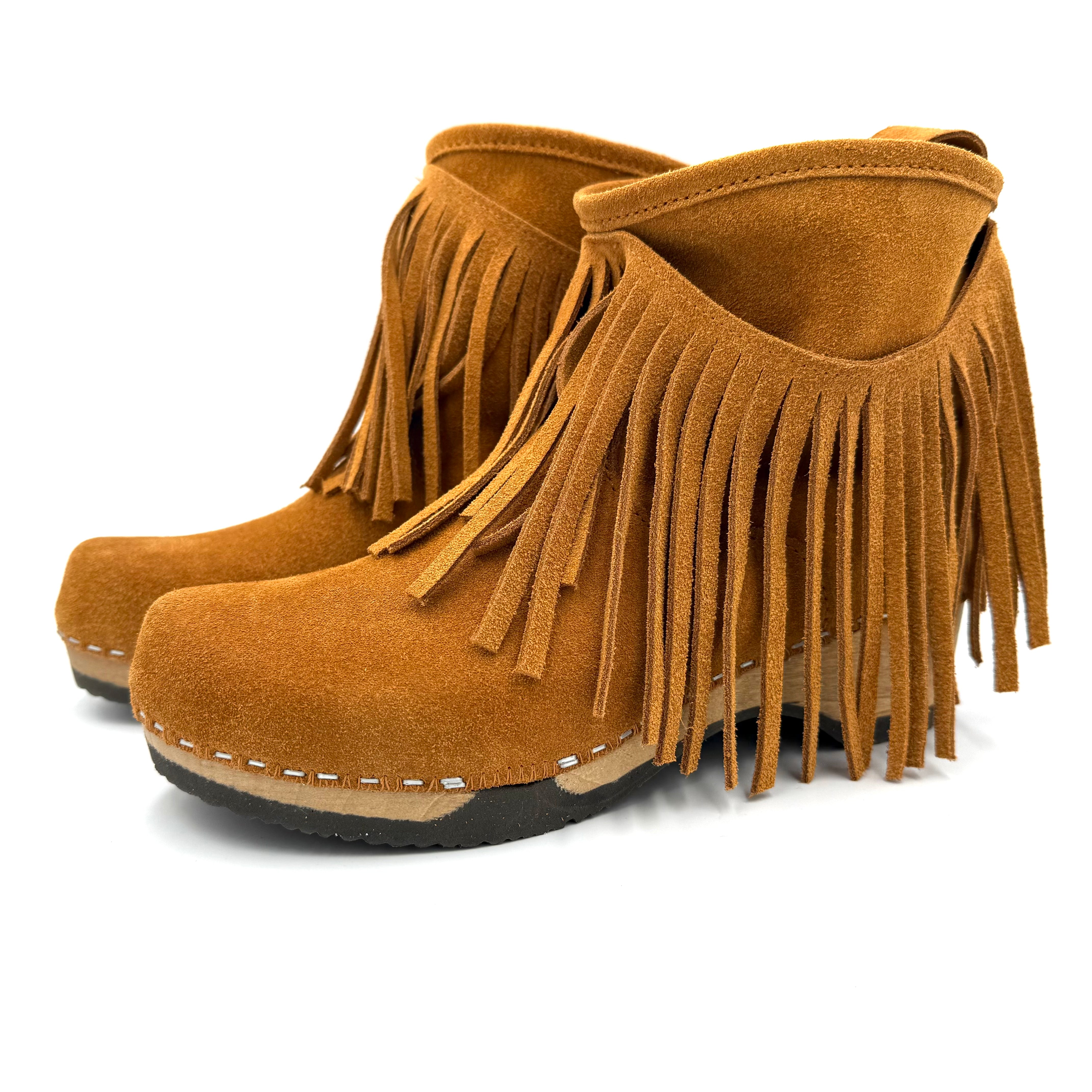Pair of brown suede fringe boots on a white background