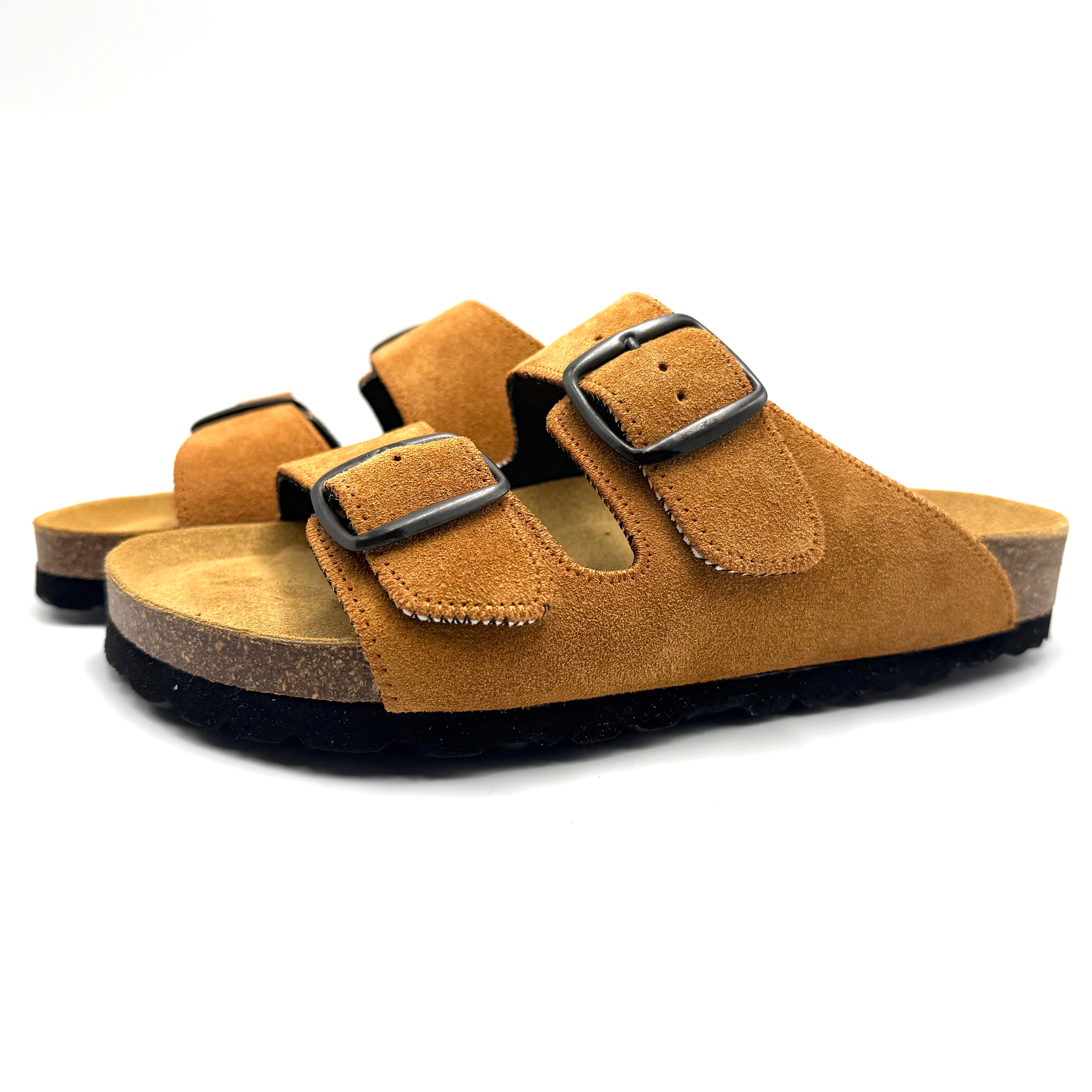 Brown sandal with a buckle on a white background