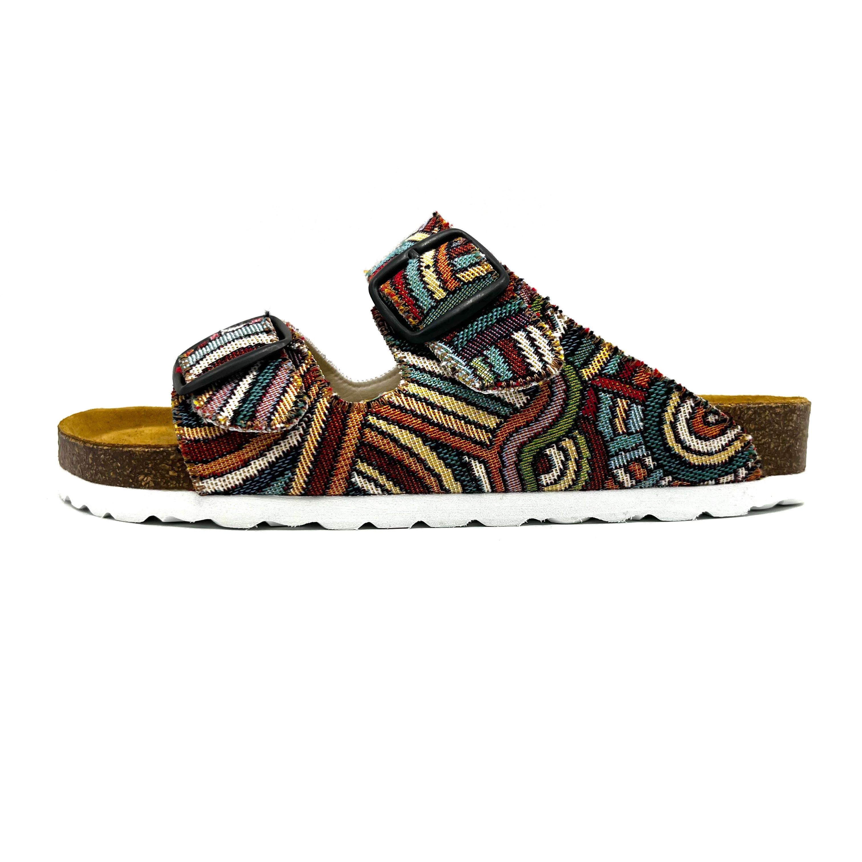 Multicolored sandal with patterned strap on a white background