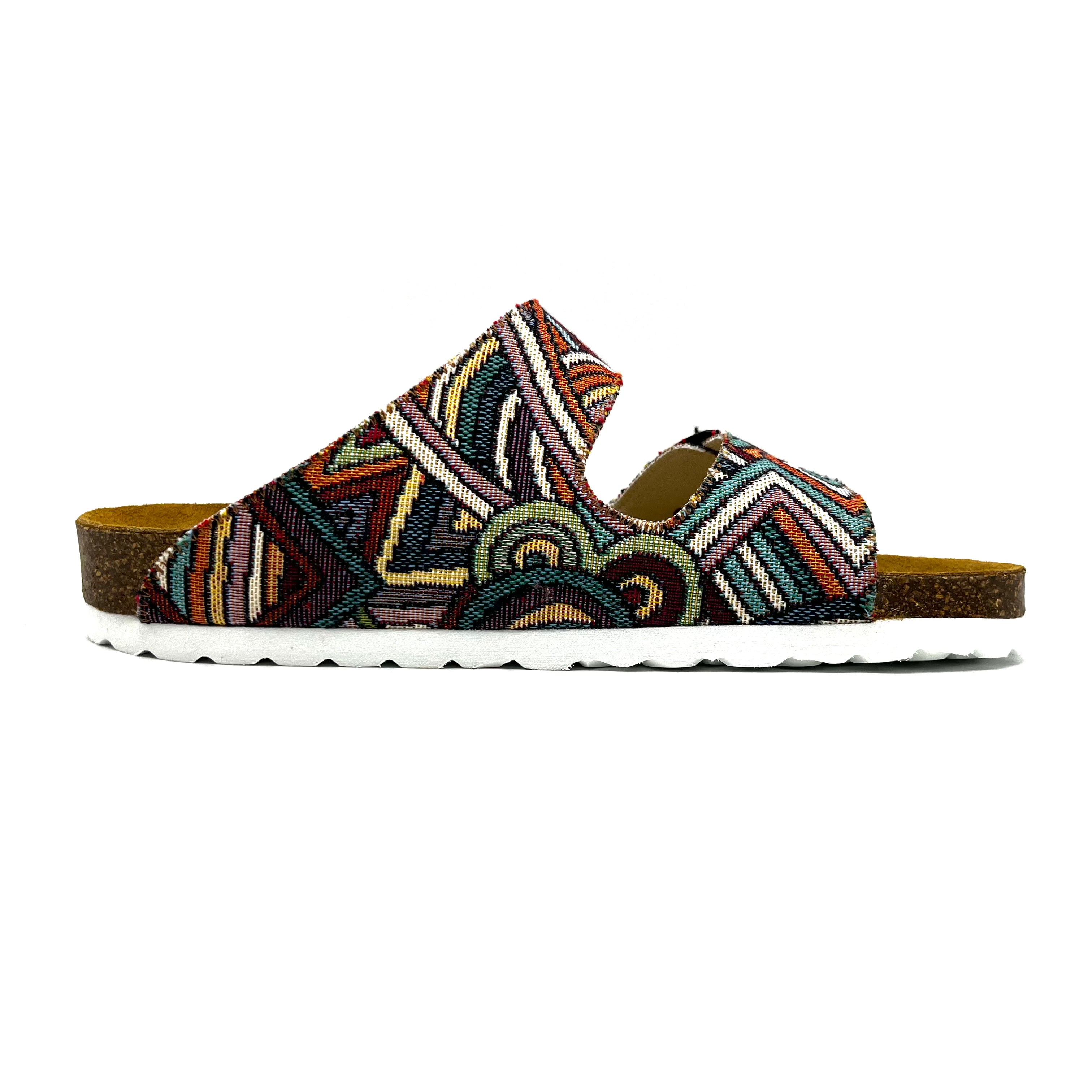 Multicolored patterned sandal on a white background