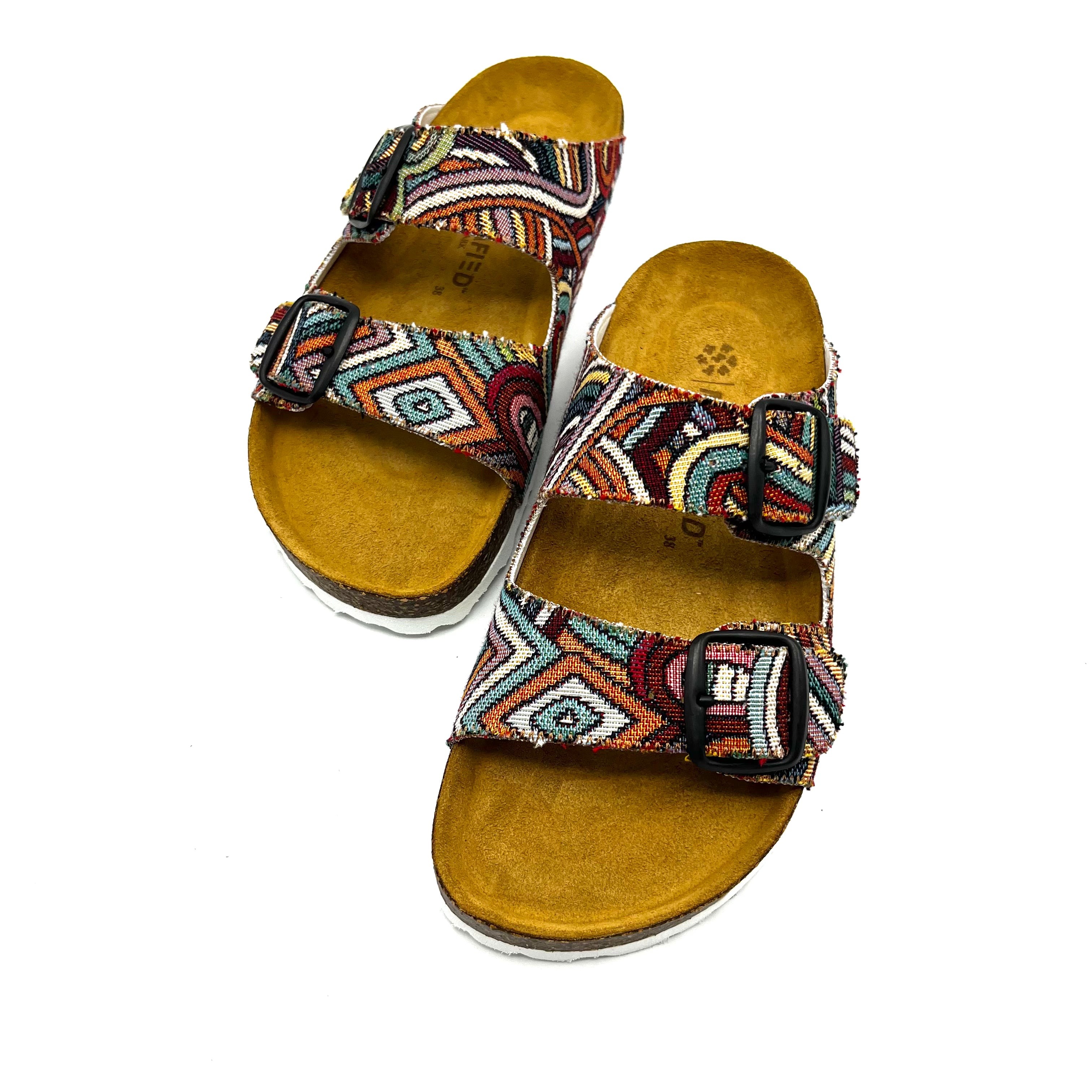 Pair of sandals with patterned straps on a white background