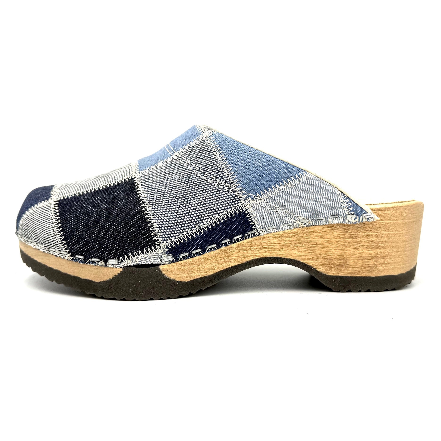 Patchwork clog shoe with wooden sole on a white background