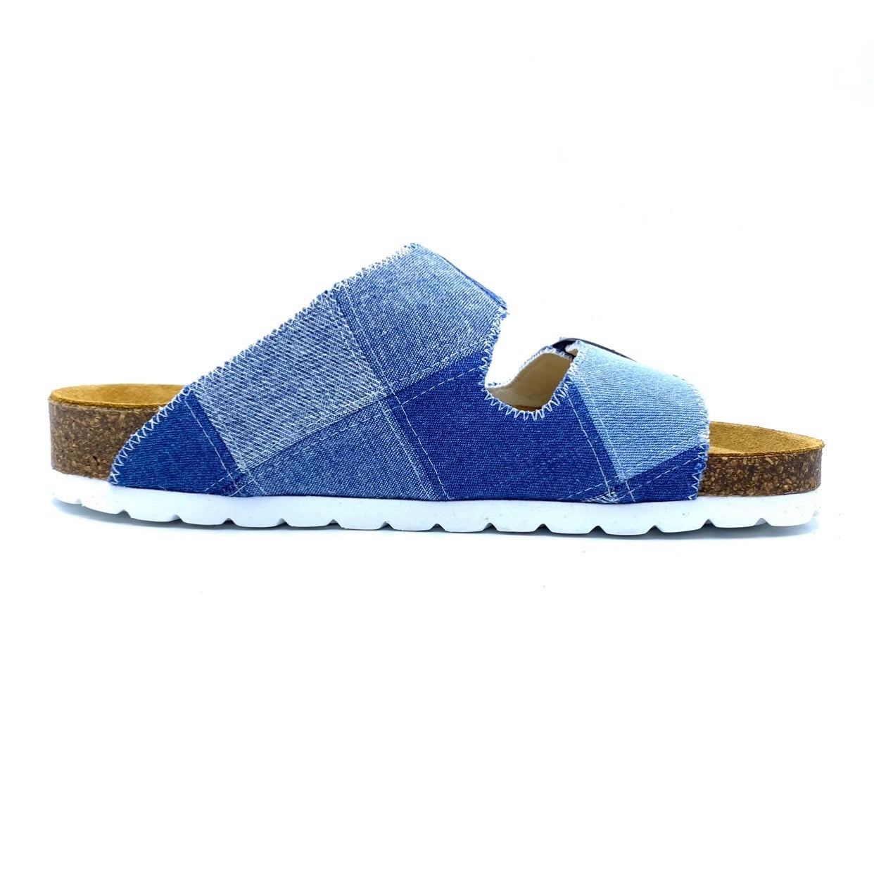 Blue patchwork sandal with brown sole on a white background