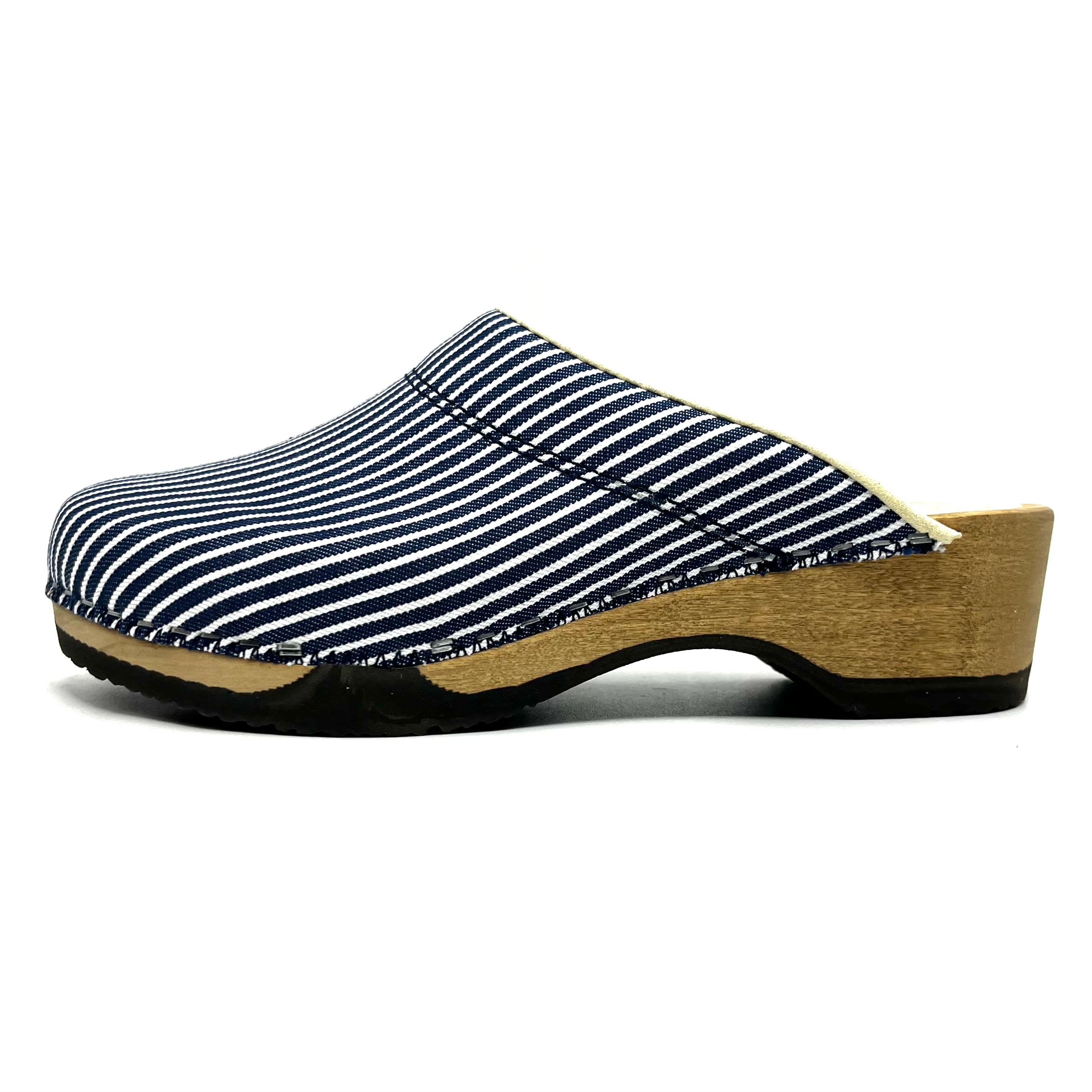 Clog shoe with striped blue and white upper and wooden sole on a white background