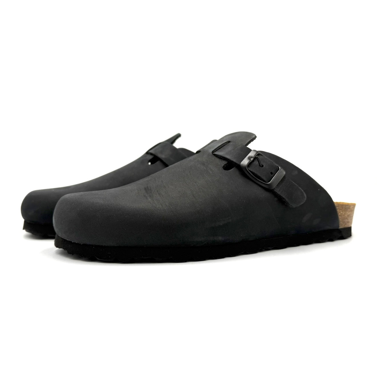 Pair of black clogs with a strap on a white background