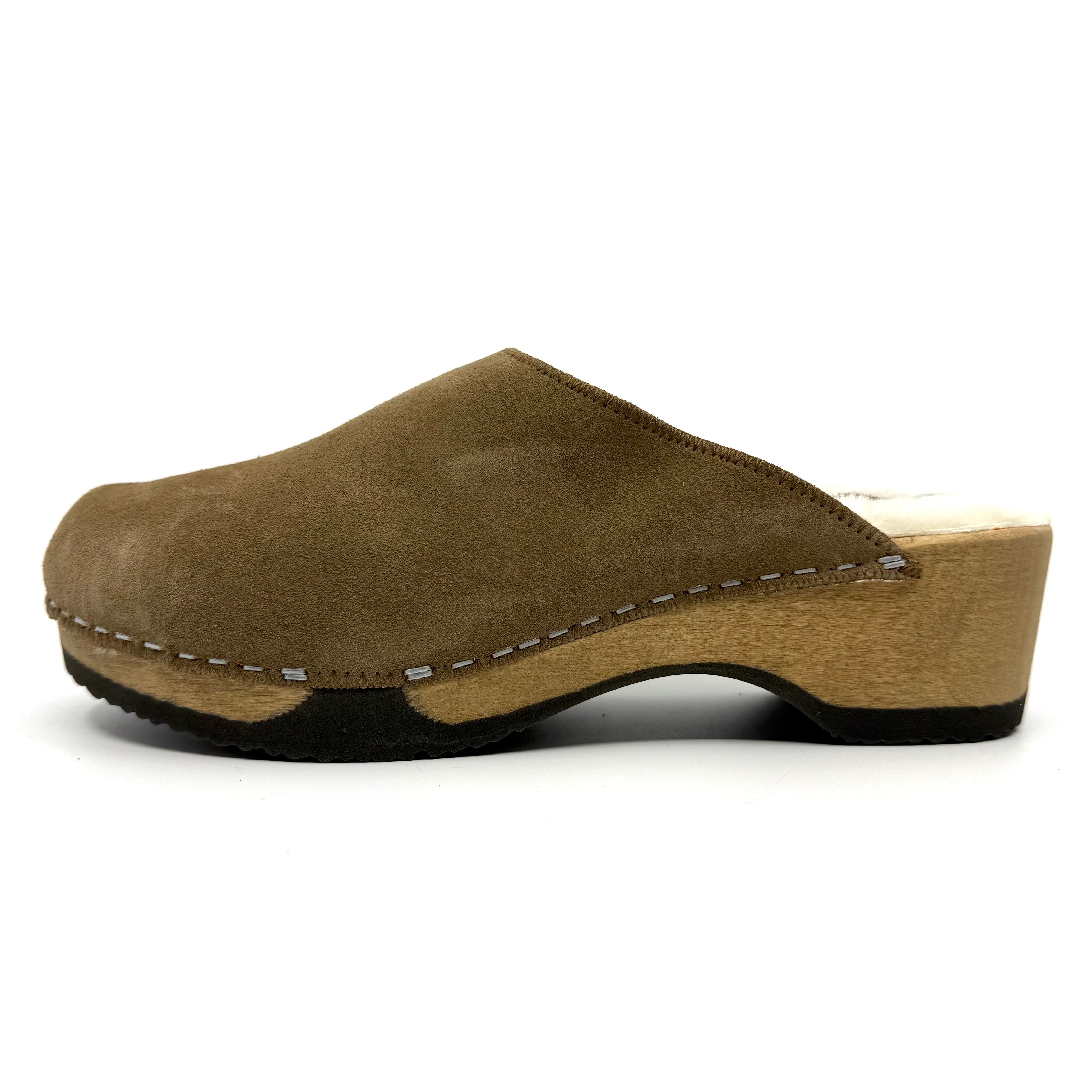 Brown suede clog shoe on a white background