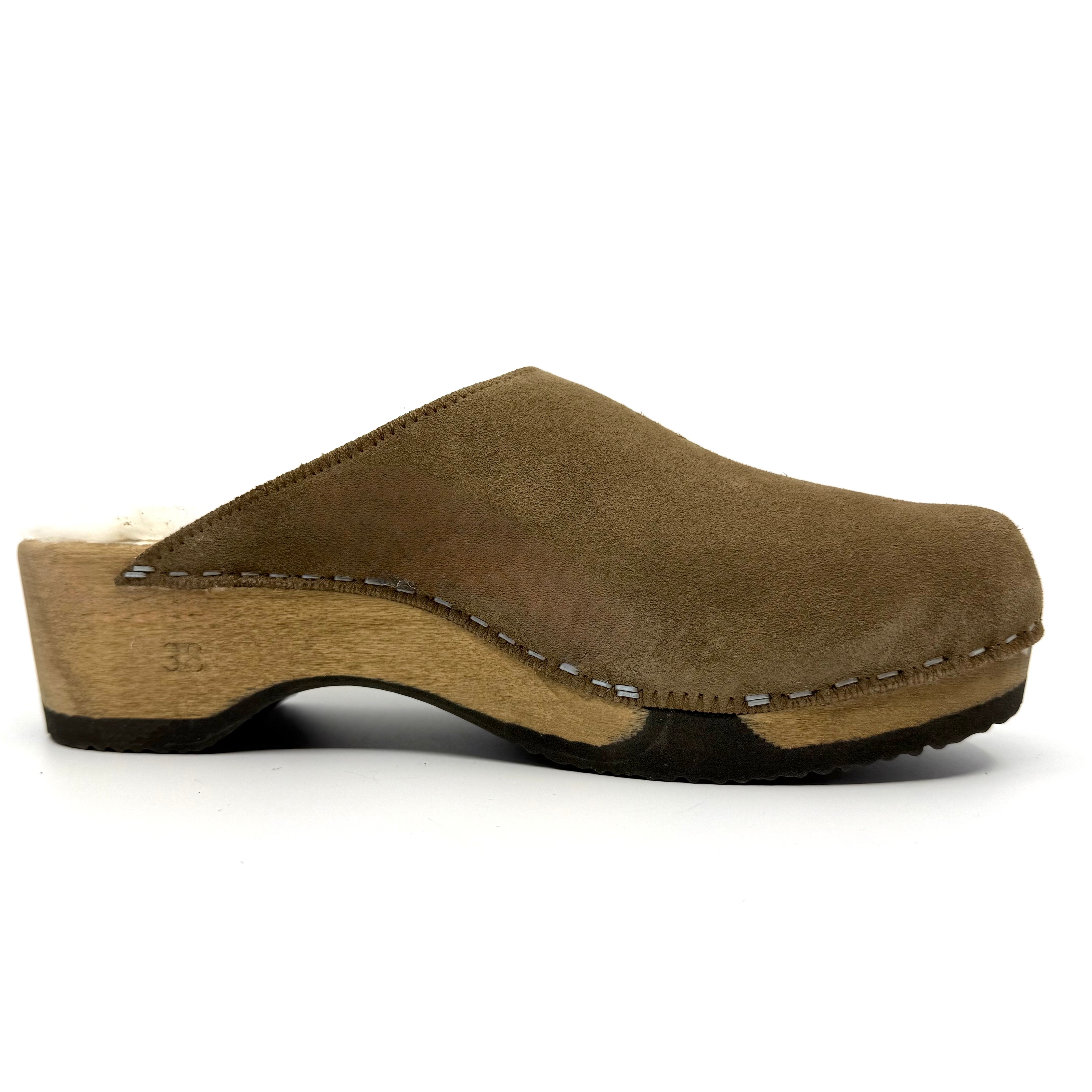 Brown wooden clog shoe on a white background