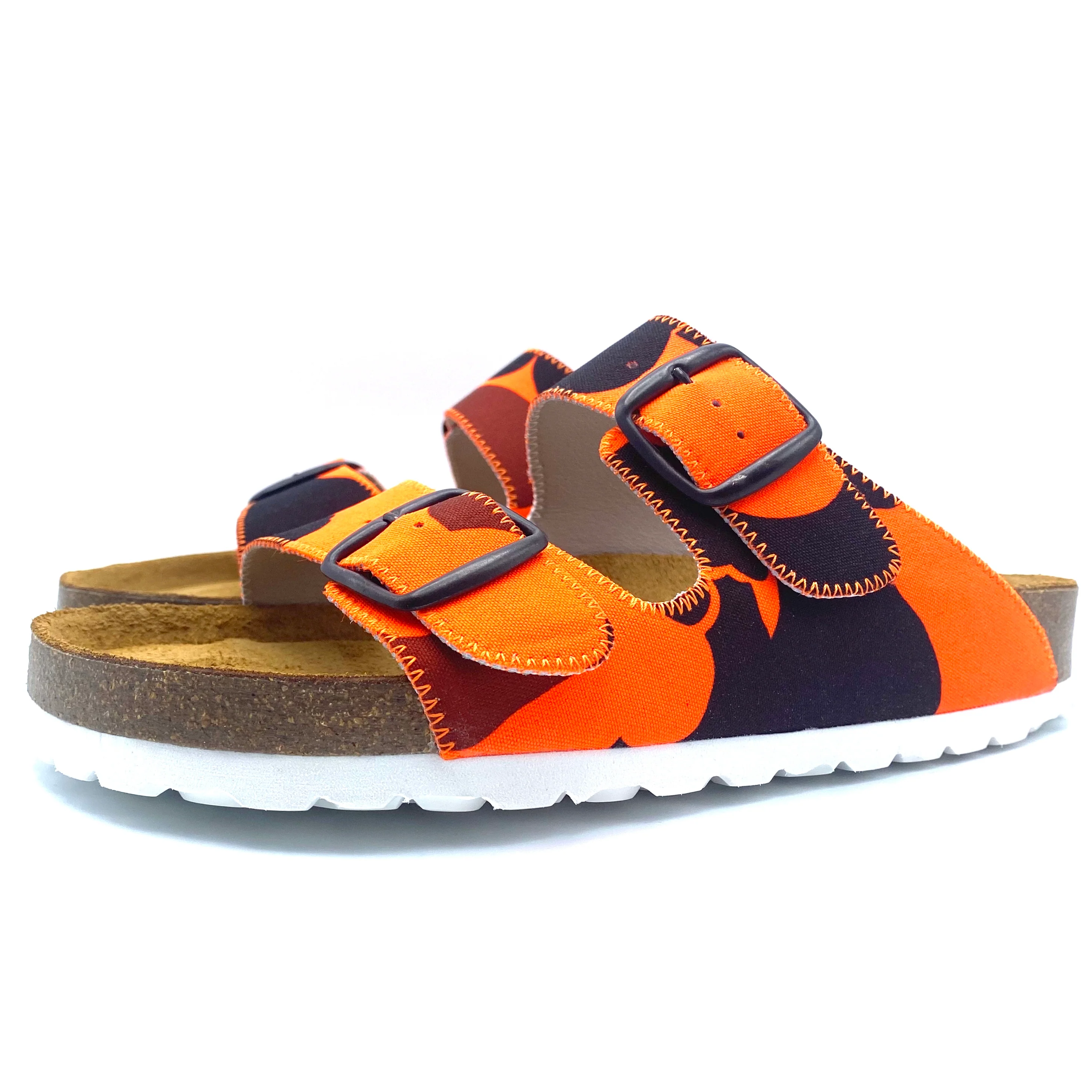 Colorful sandals with orange and black pattern on a white background
