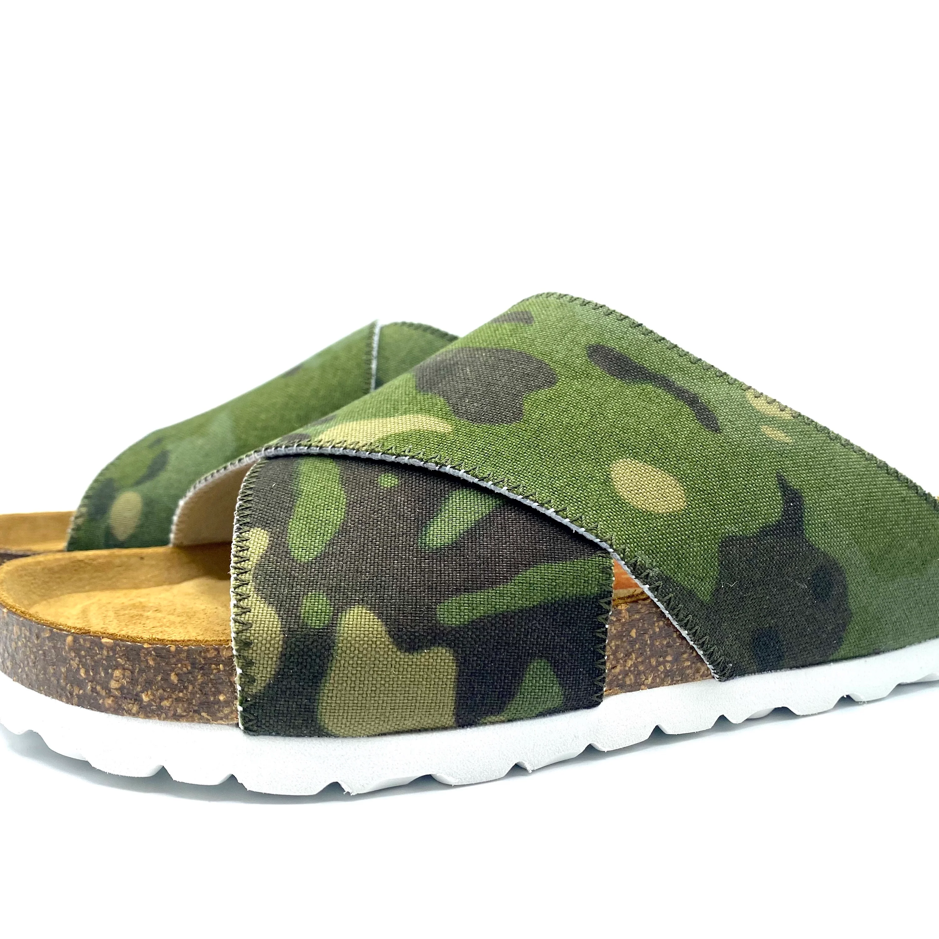 Green camouflage slide sandals with cork sole on a white background