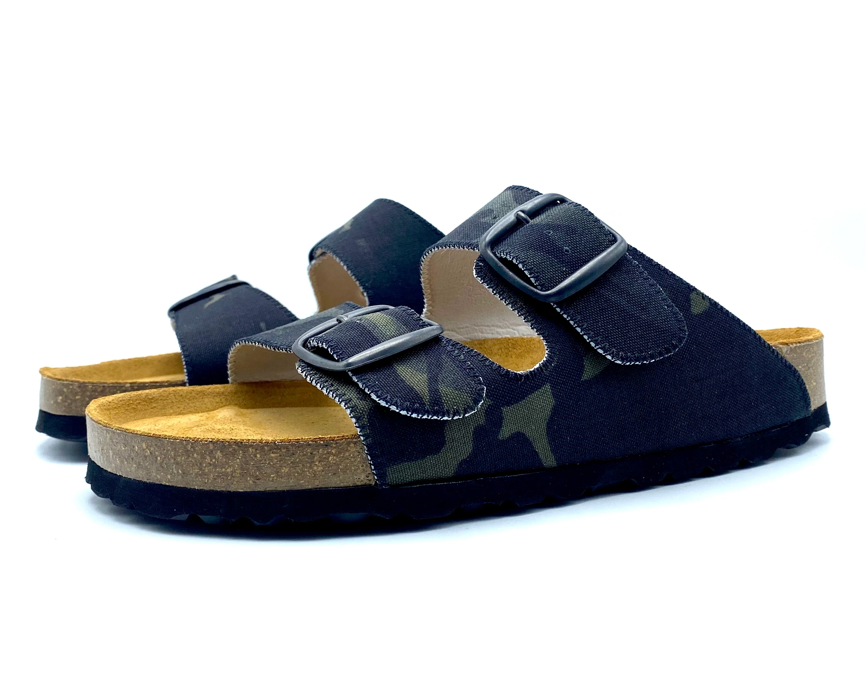 Navy blue sandals with cork soles on a white background