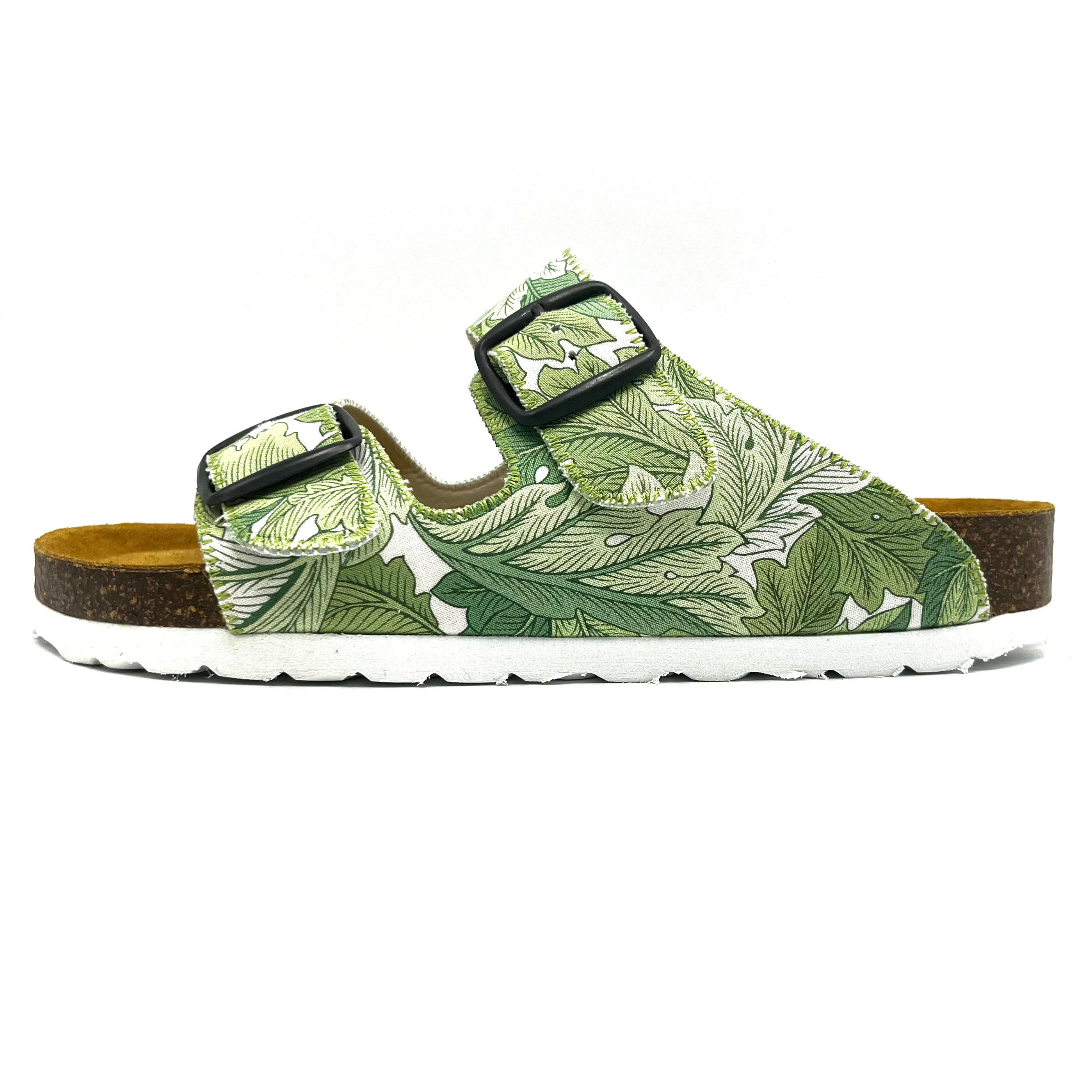 Green leaf-patterned sandal with a white sole on a white background