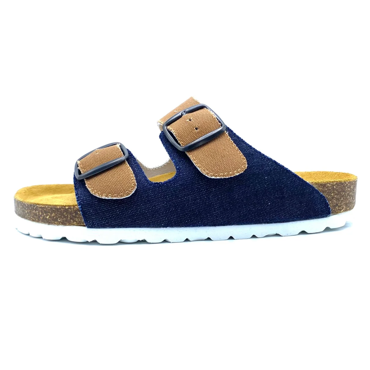 Navy sandal with tan straps on a white background