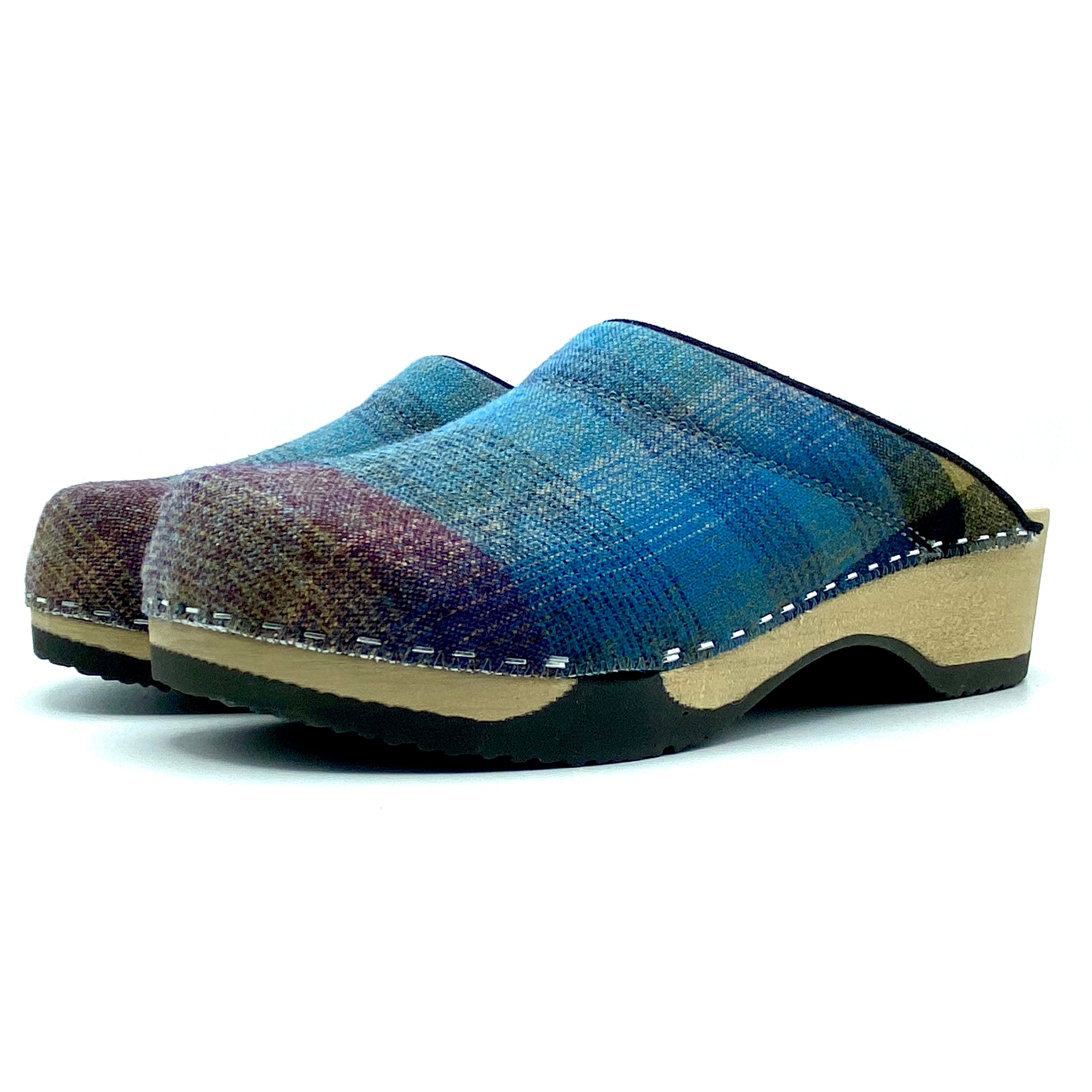 Blue woven clog shoe on a white background