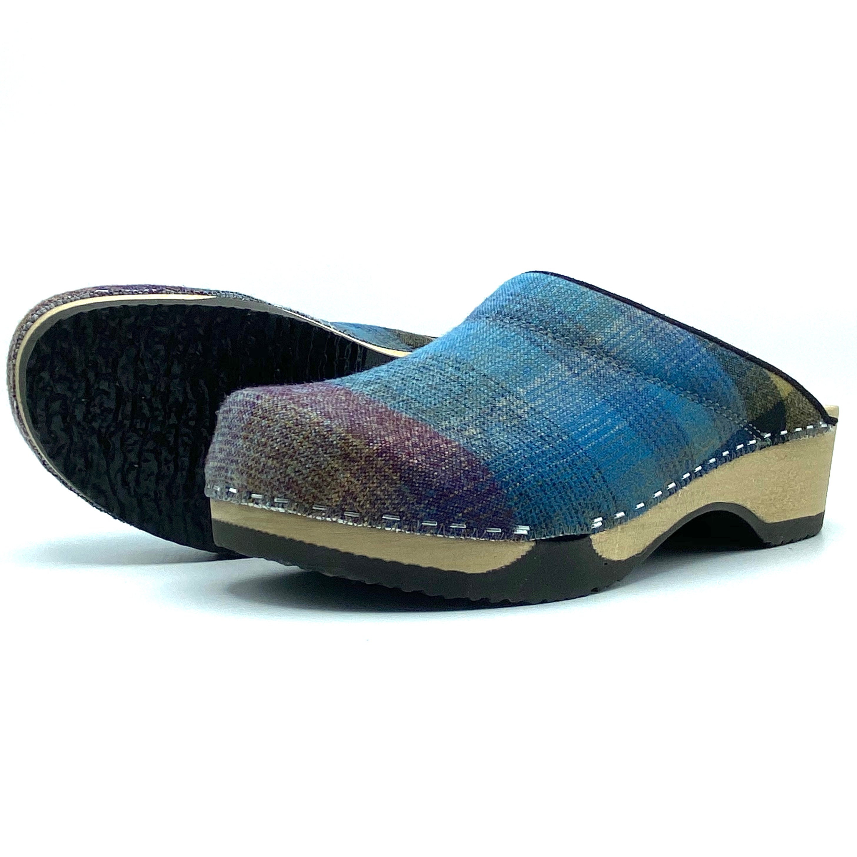 Blue woven clog shoe on a white background