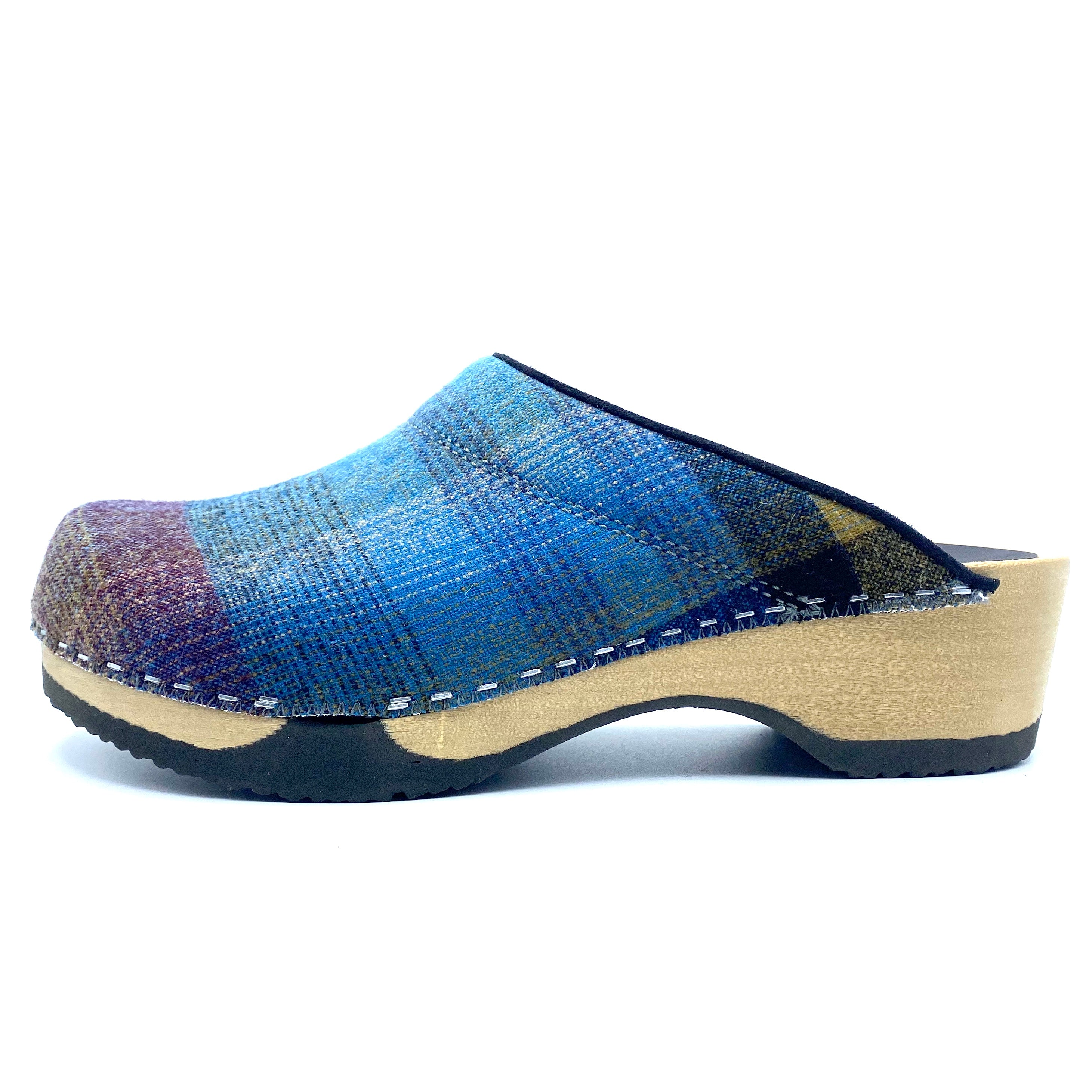 Blue woven clog shoe on a white background