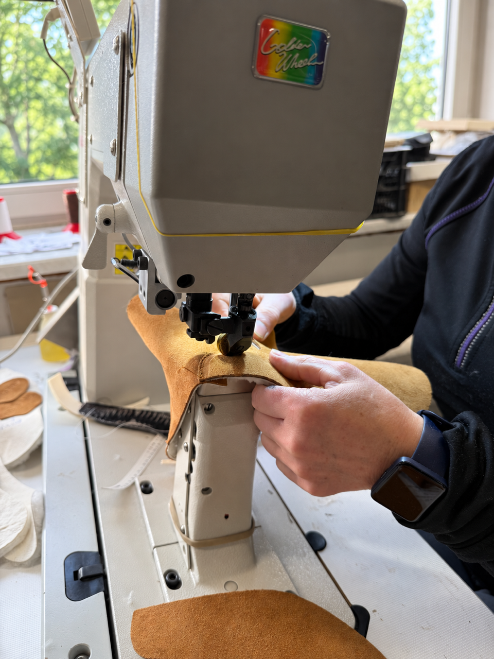Brown suede for a Holly boot being stitched by hand in the KUNSTEN workshop