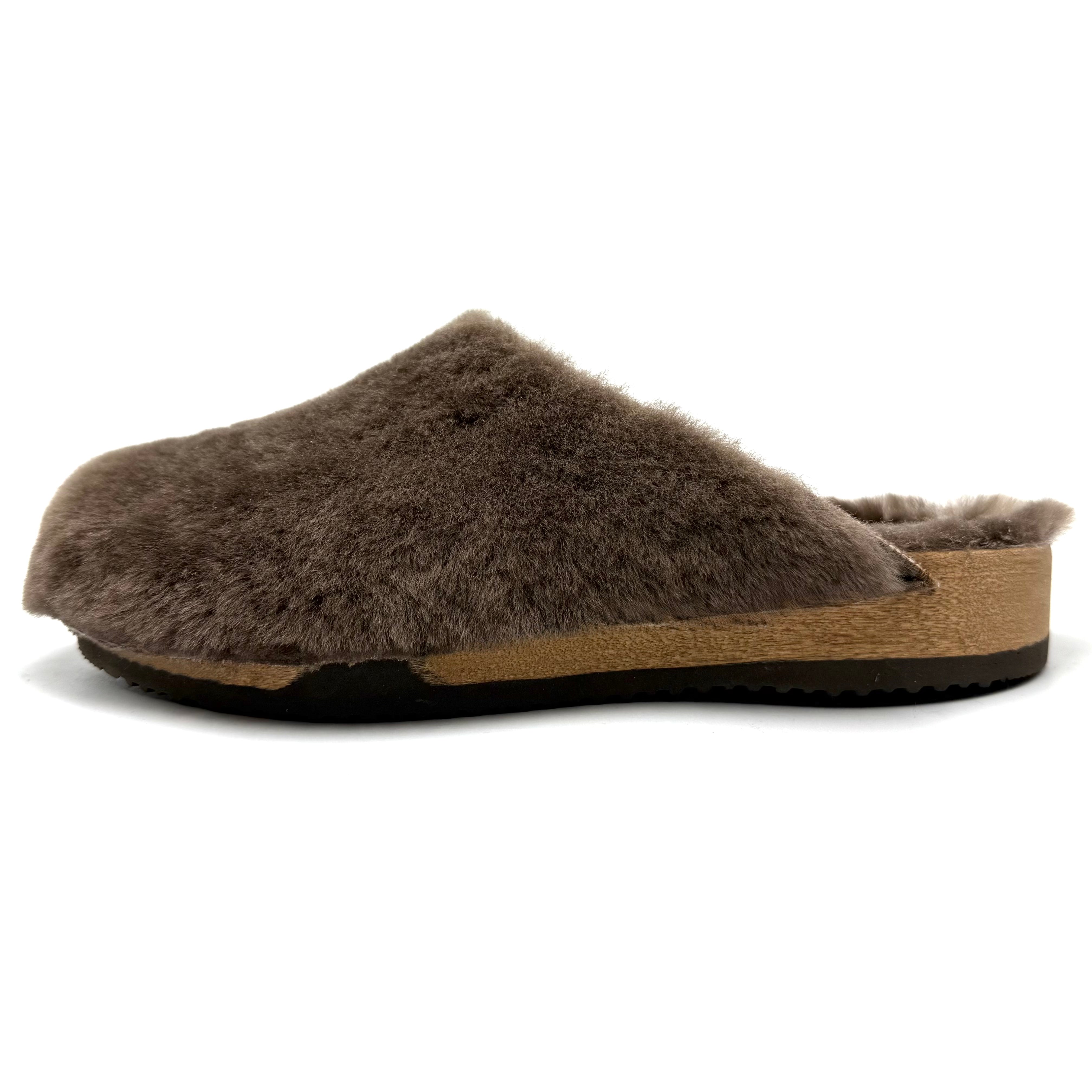 A single Pure lambswool slip-on clog shoe  inside cashmereinside  with a aspen sole and black outsole, shown from a side profile on a white background 