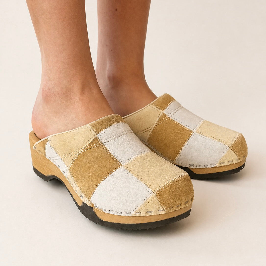 Pair of no. 1 patchwork clogs on a white background
