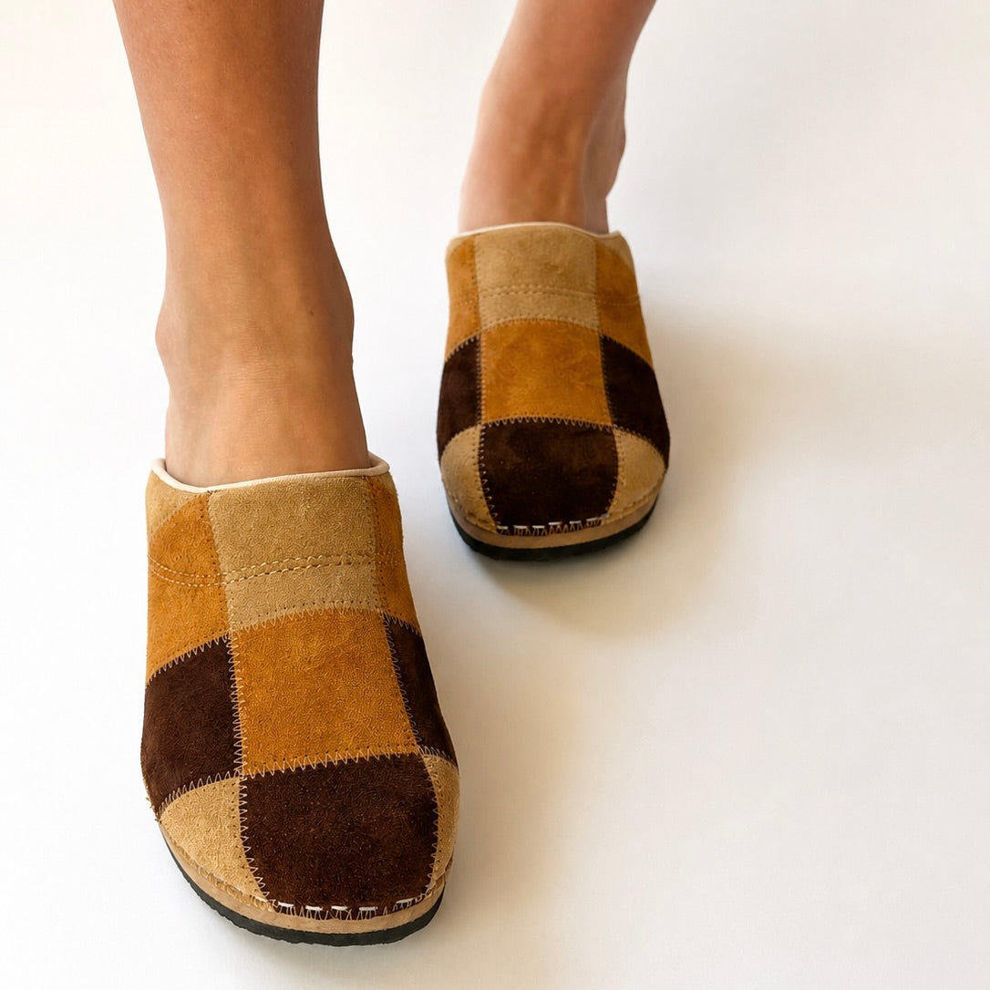 Pair of checkered slippers on a white background