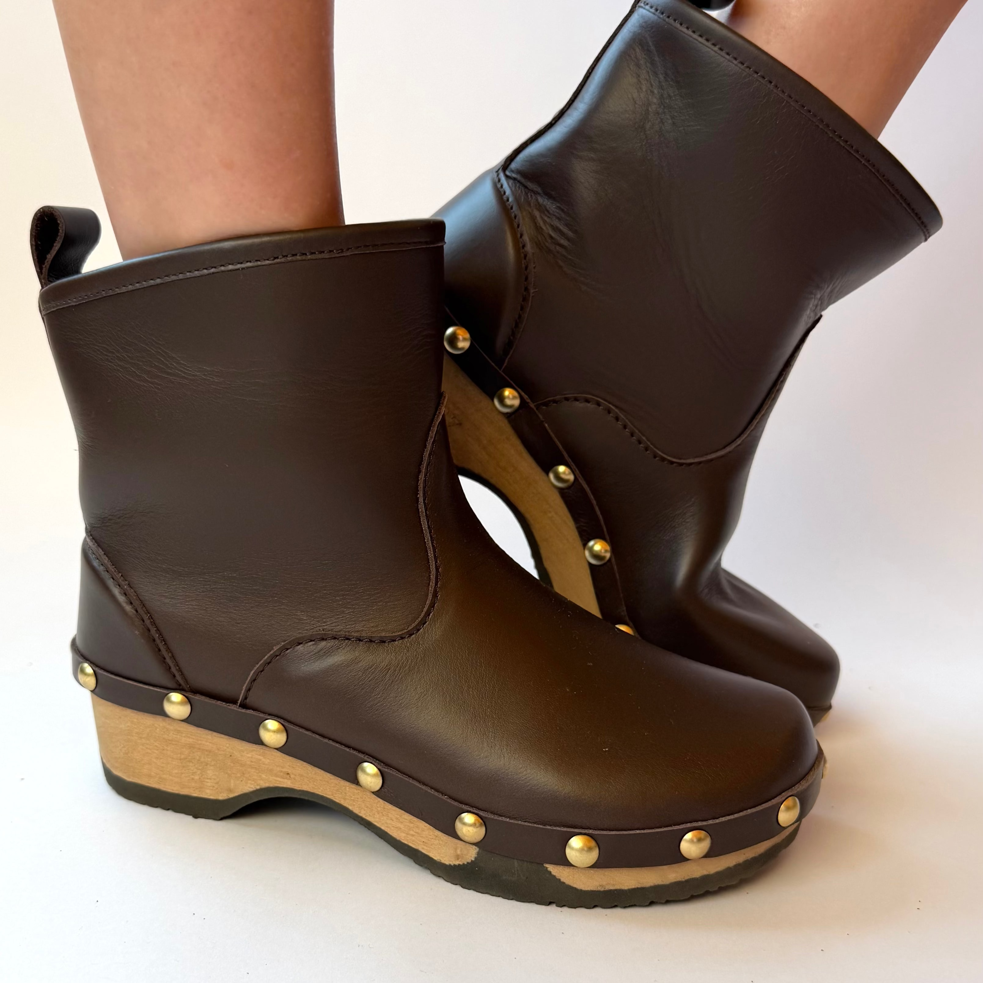 French rich brown leather studs boot on a white background