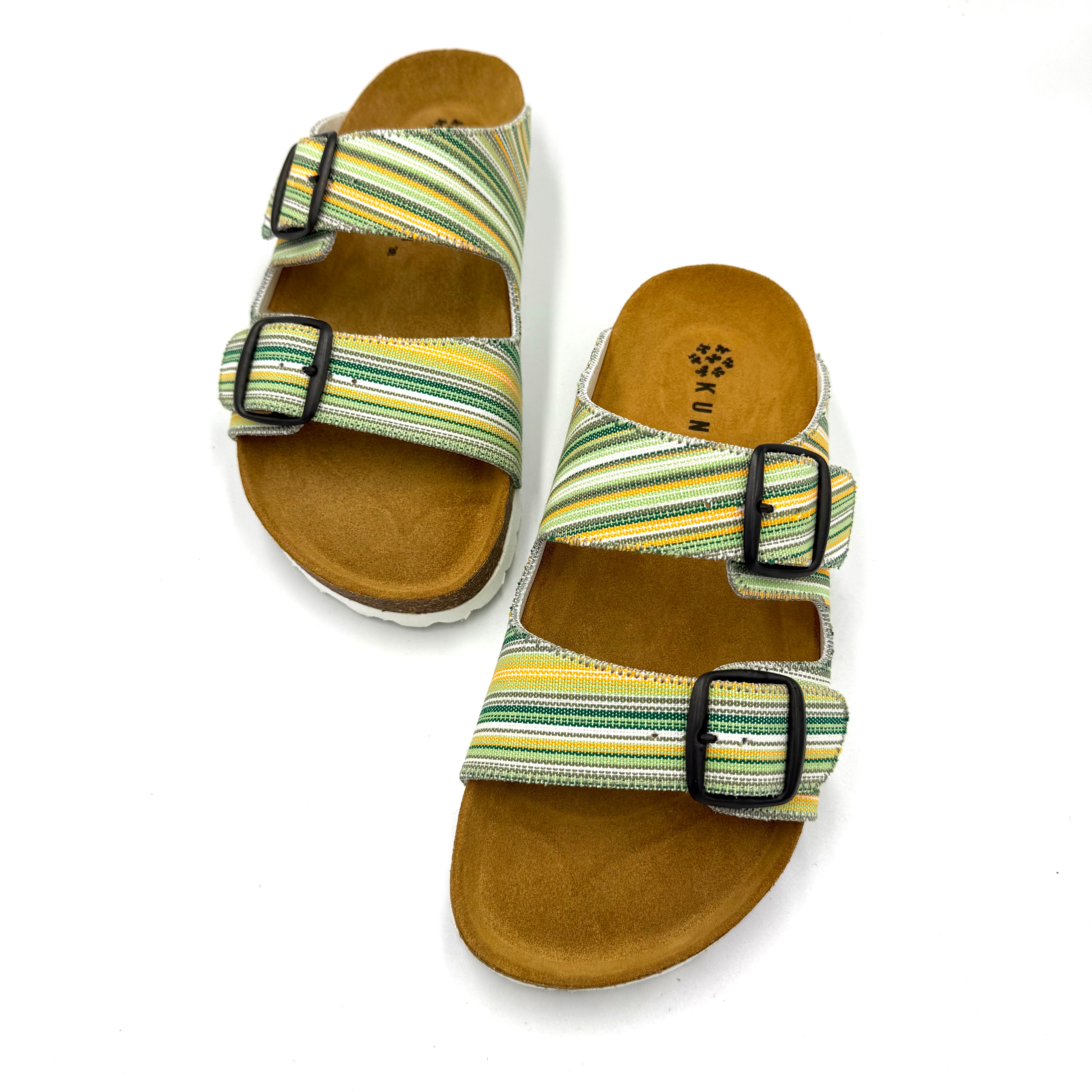 Pair of sandals with striped straps on a white background