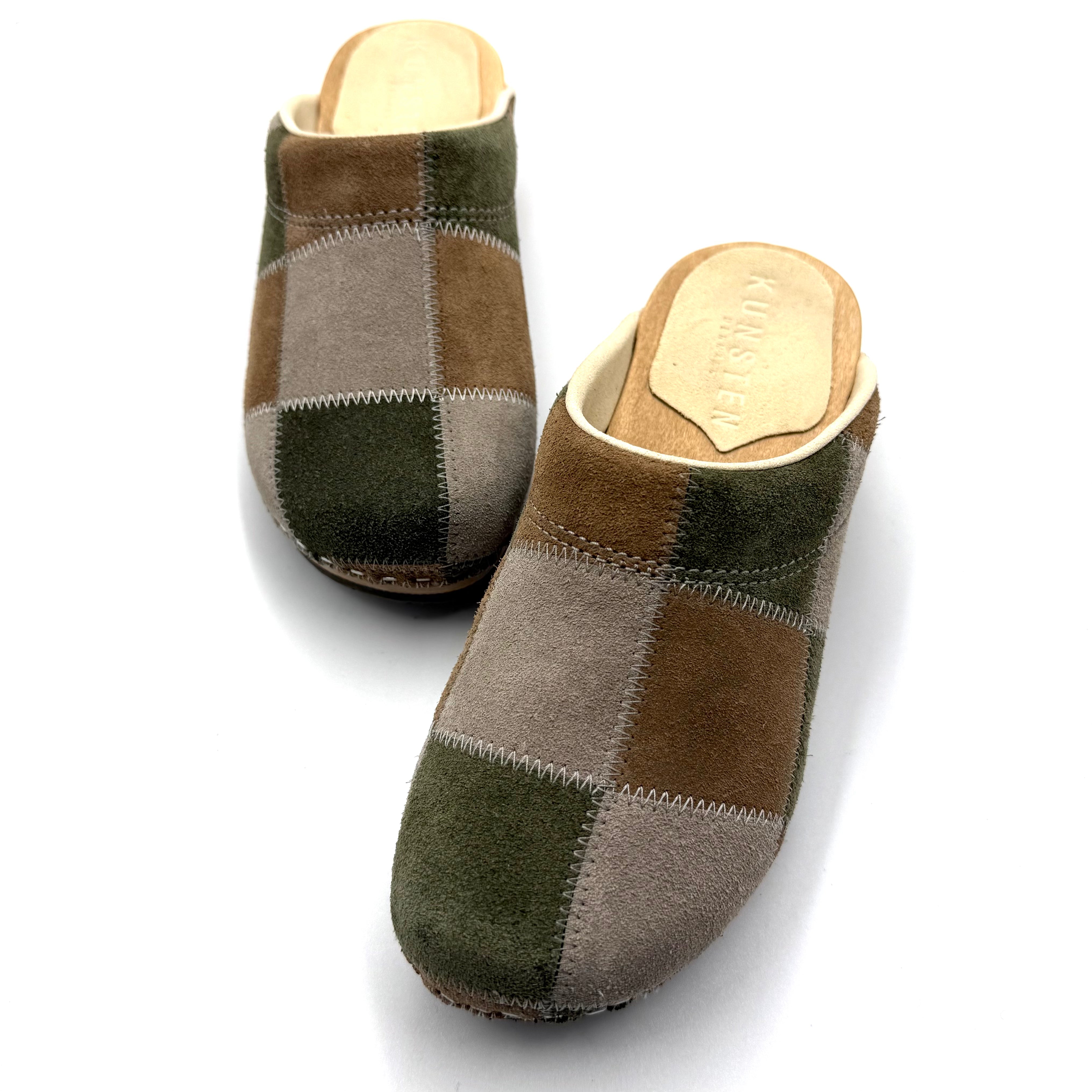 Pair of patchwork slippers on a white background