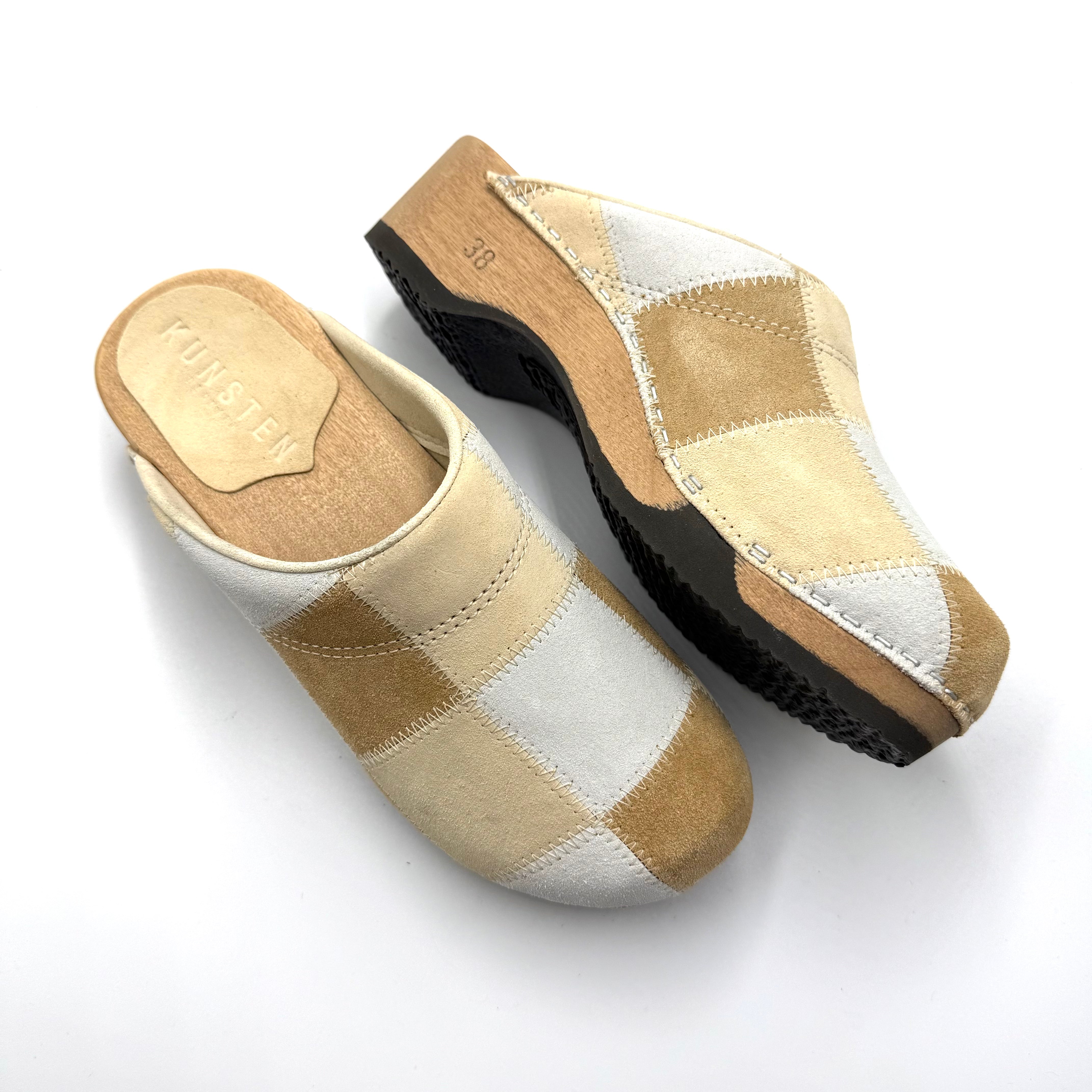 Pair of checkered slippers on a white background