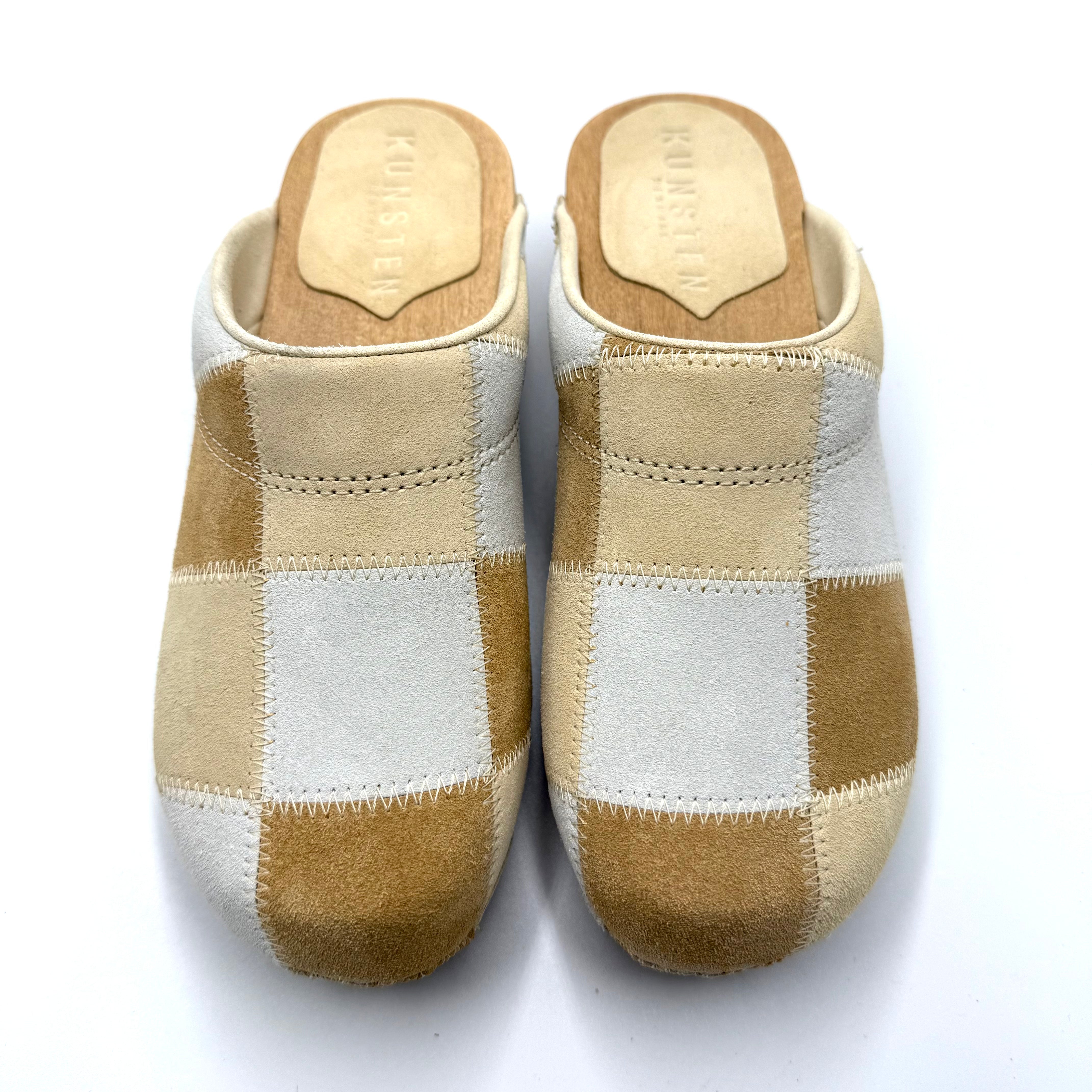 Pair of checkered slippers on a white background