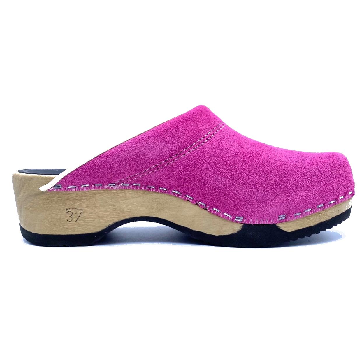 Pink wooden clog shoe on a white background