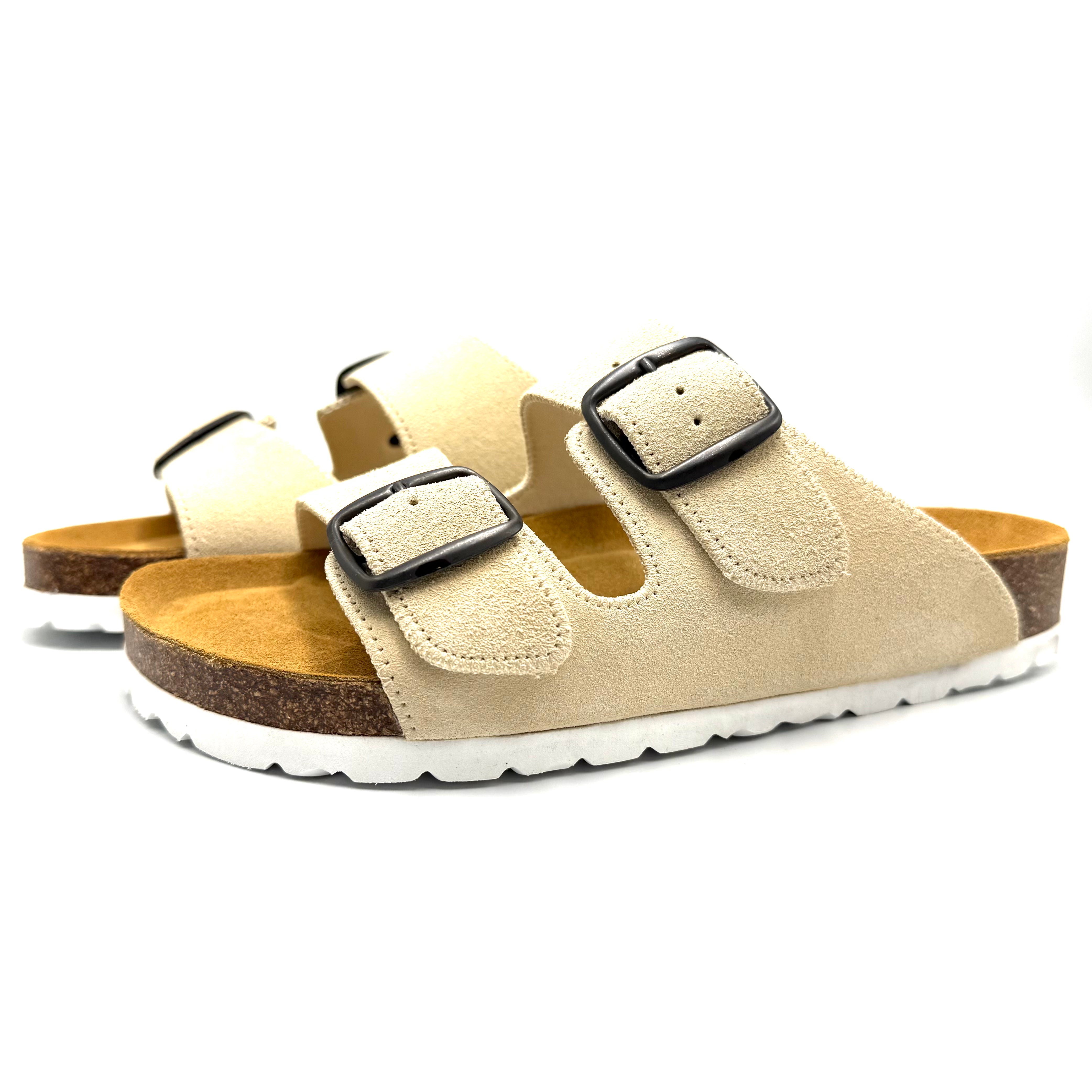 Beige sandal with cork sole on a white background