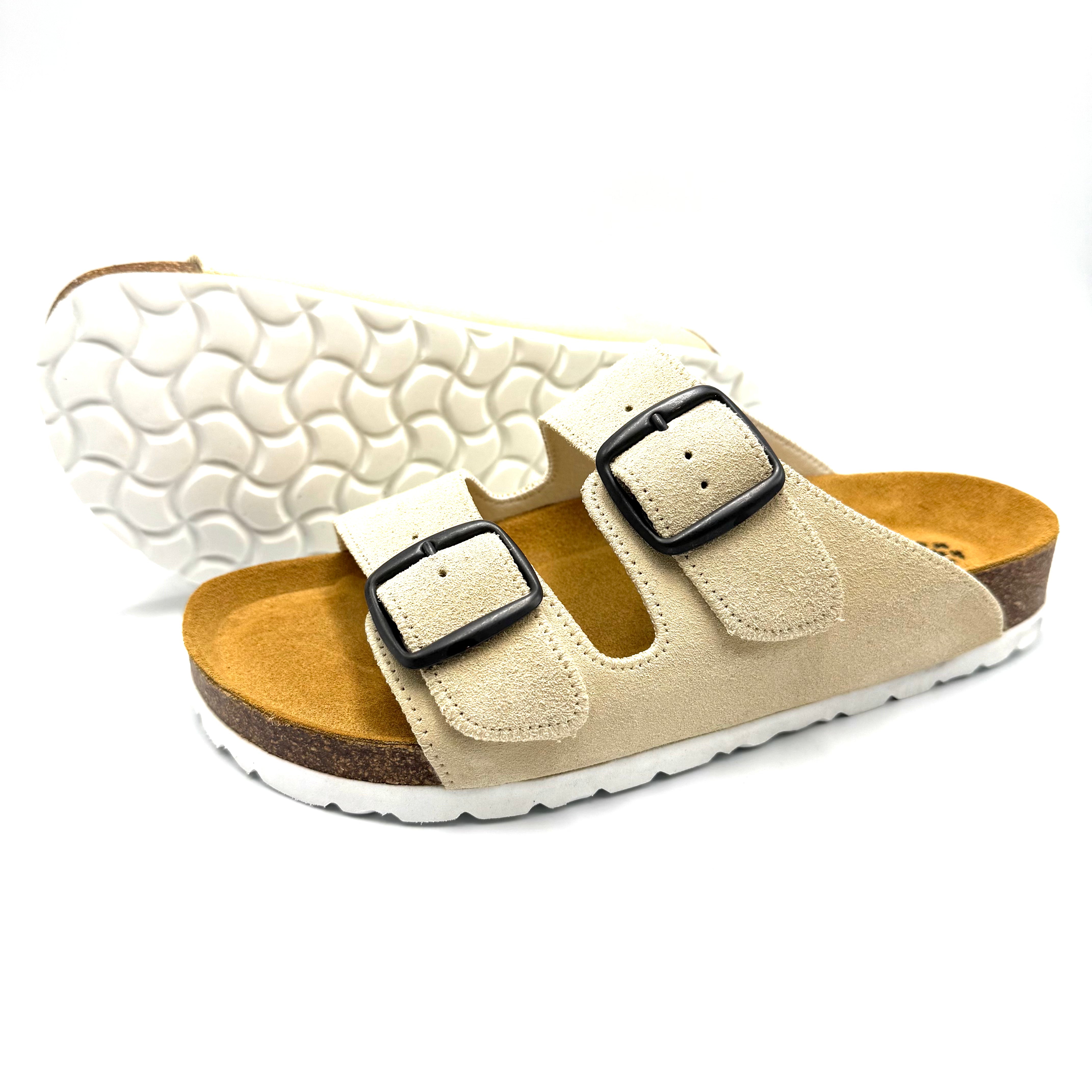 Beige sandal with cork sole on a white background