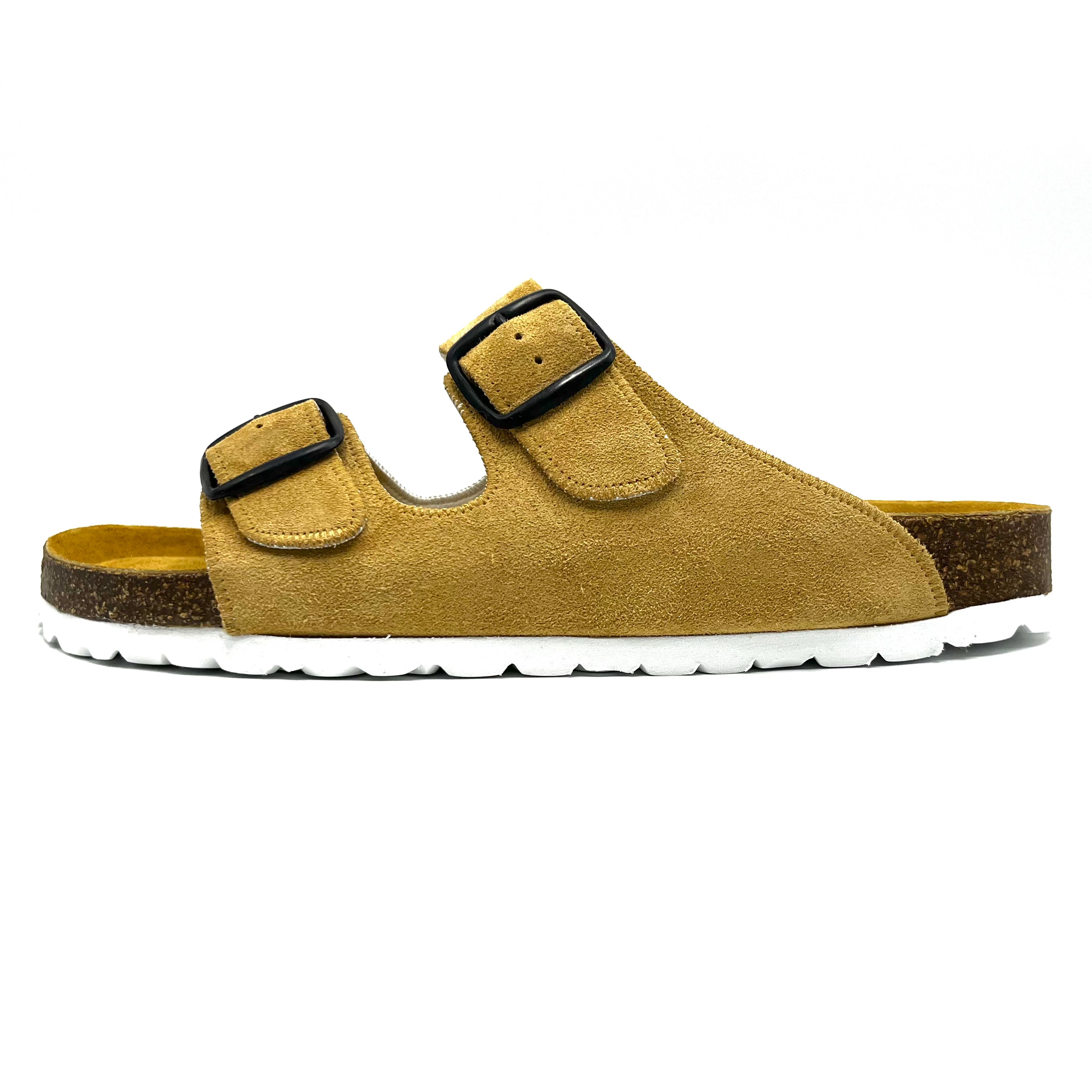 Yellow sandal with black buckles on a white background