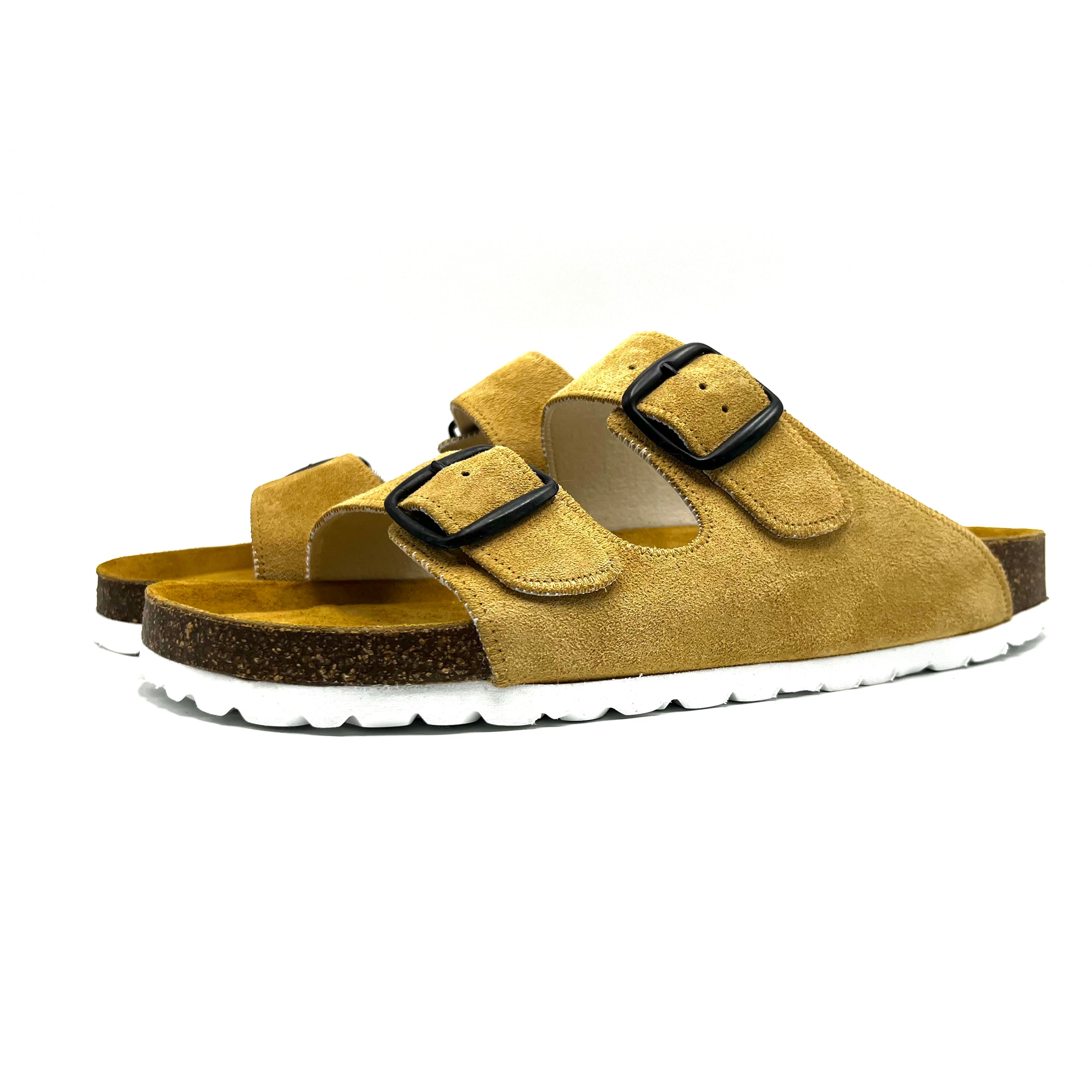 Yellow sandal with black buckles on a white background