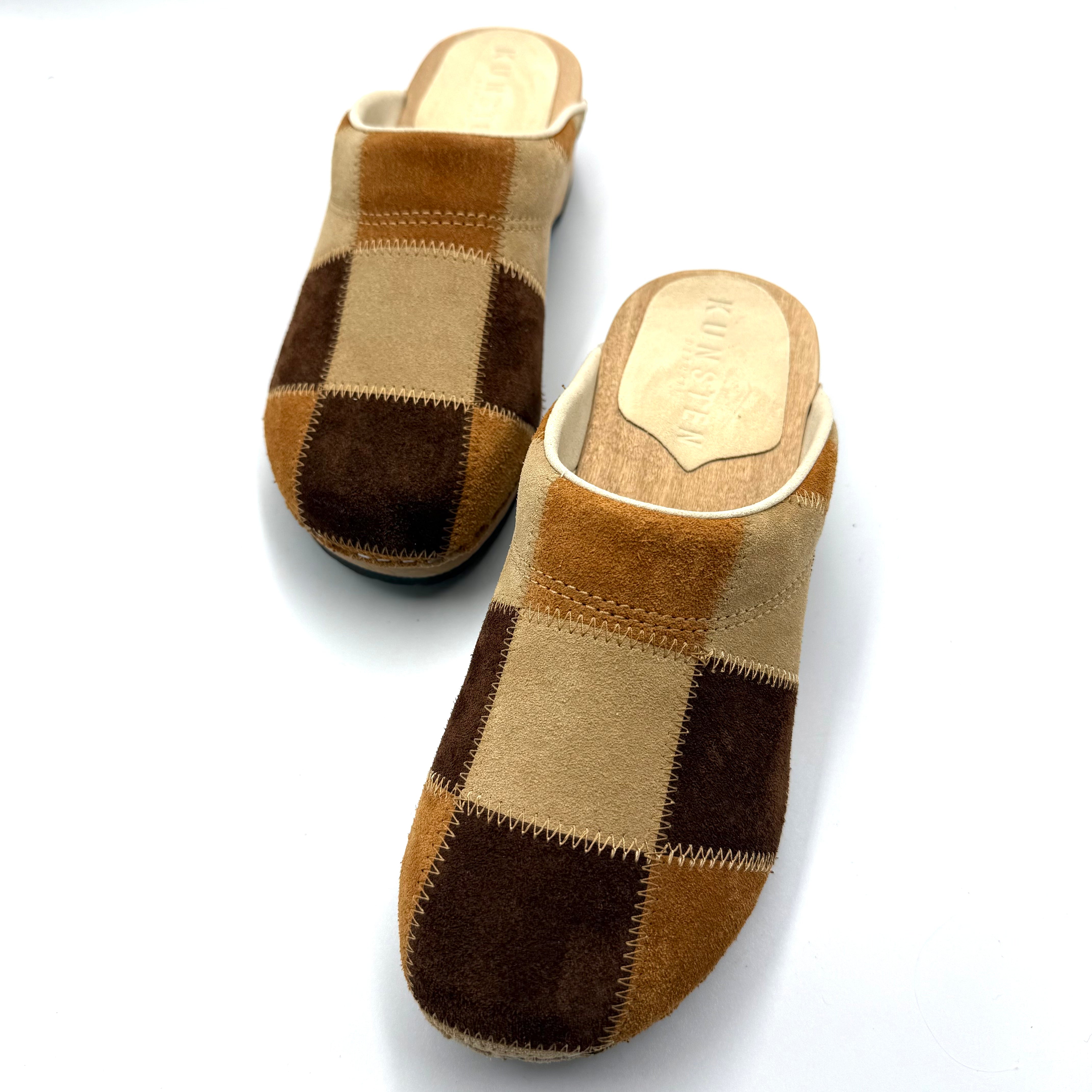 Pair of checkered slippers on a white background