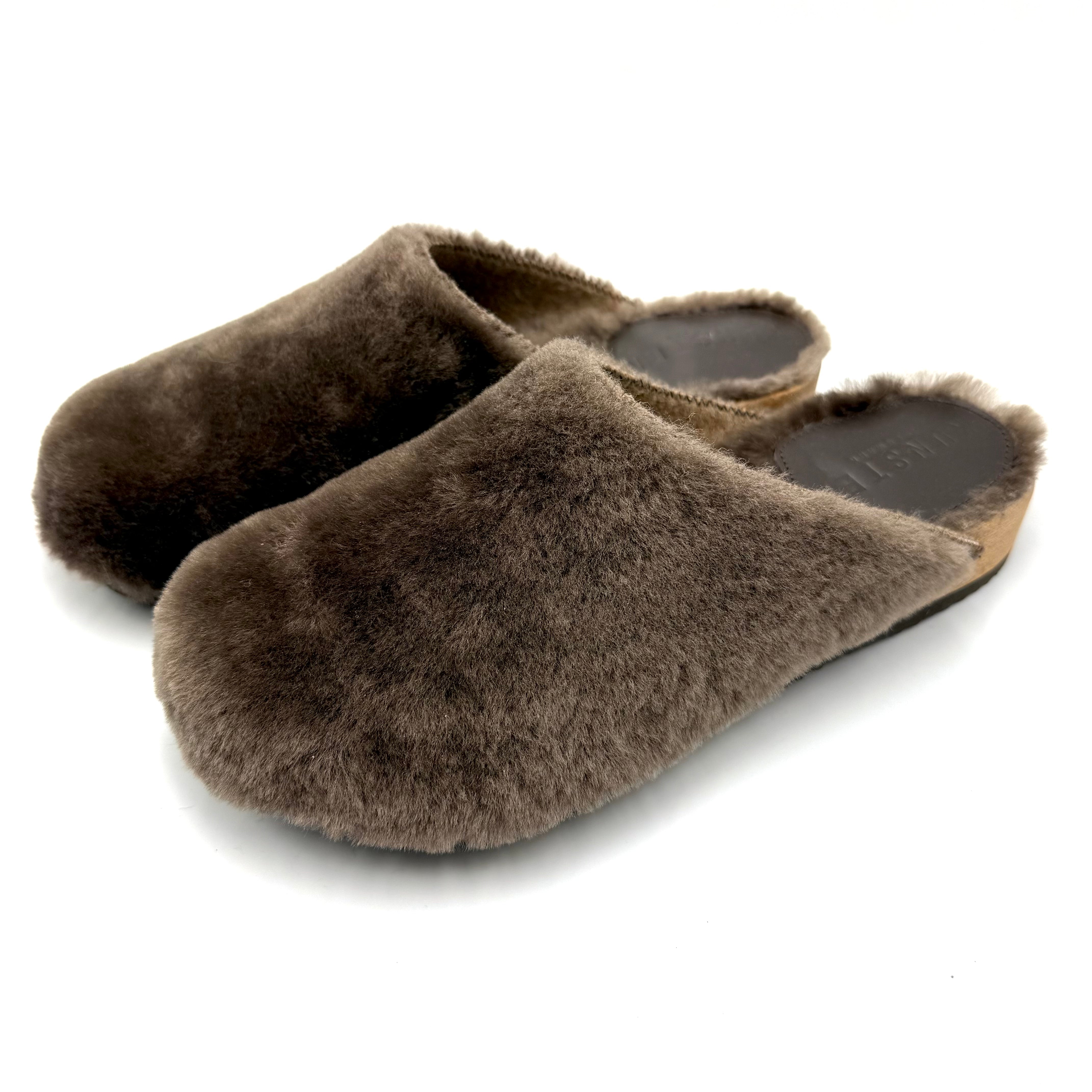 A pair of brown lambswool cashmere slip-on slippers shown on a clean white background.