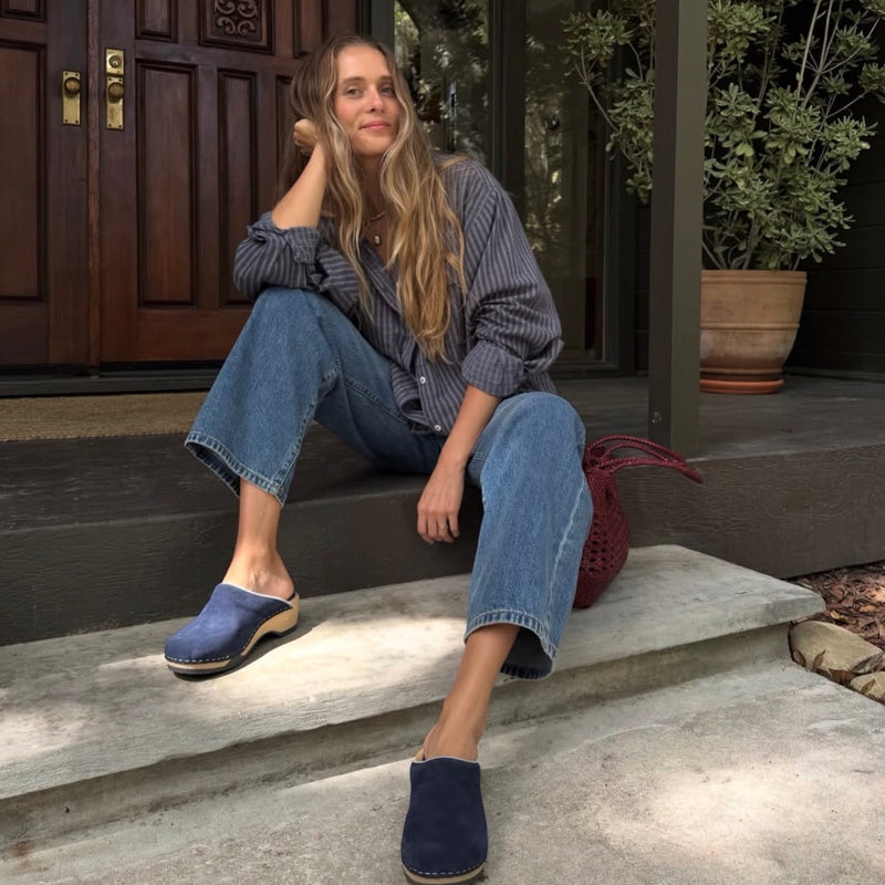 a girl wearing embla midnight navy suede 